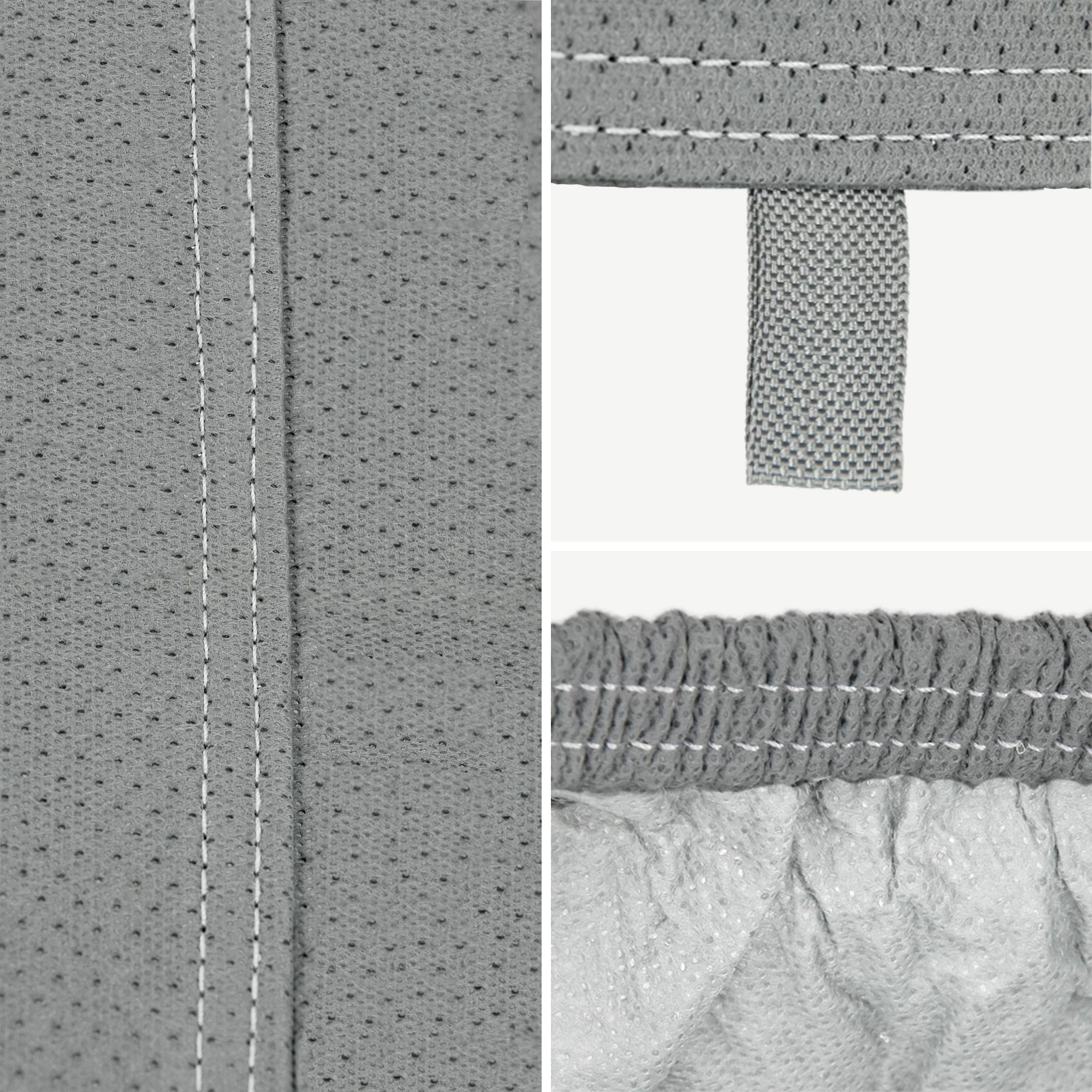 Detailní záběr šedého materiálu se švy a smyčkovou páskou.