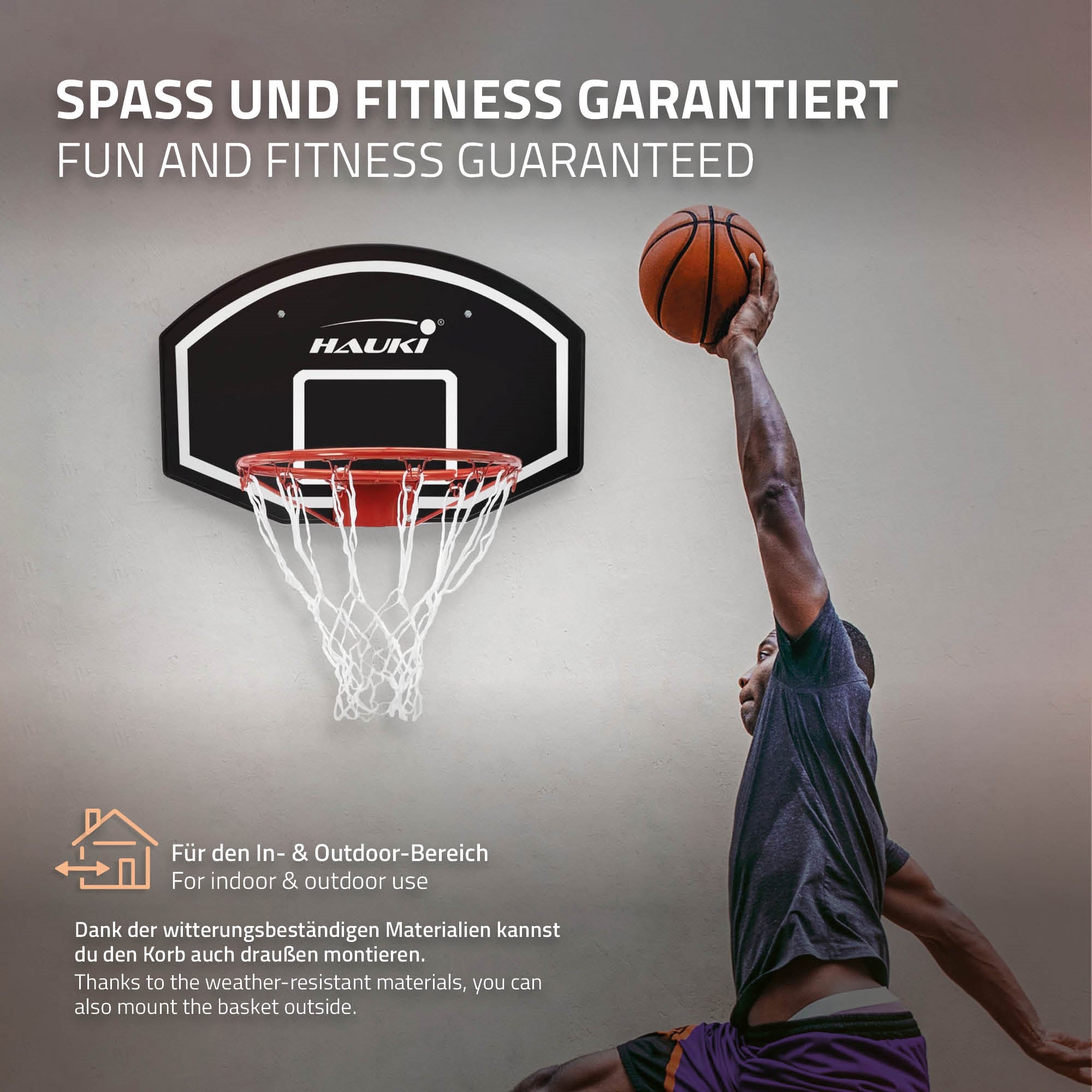 Basketball hoop mounted on a wall with a player performing a dunk.