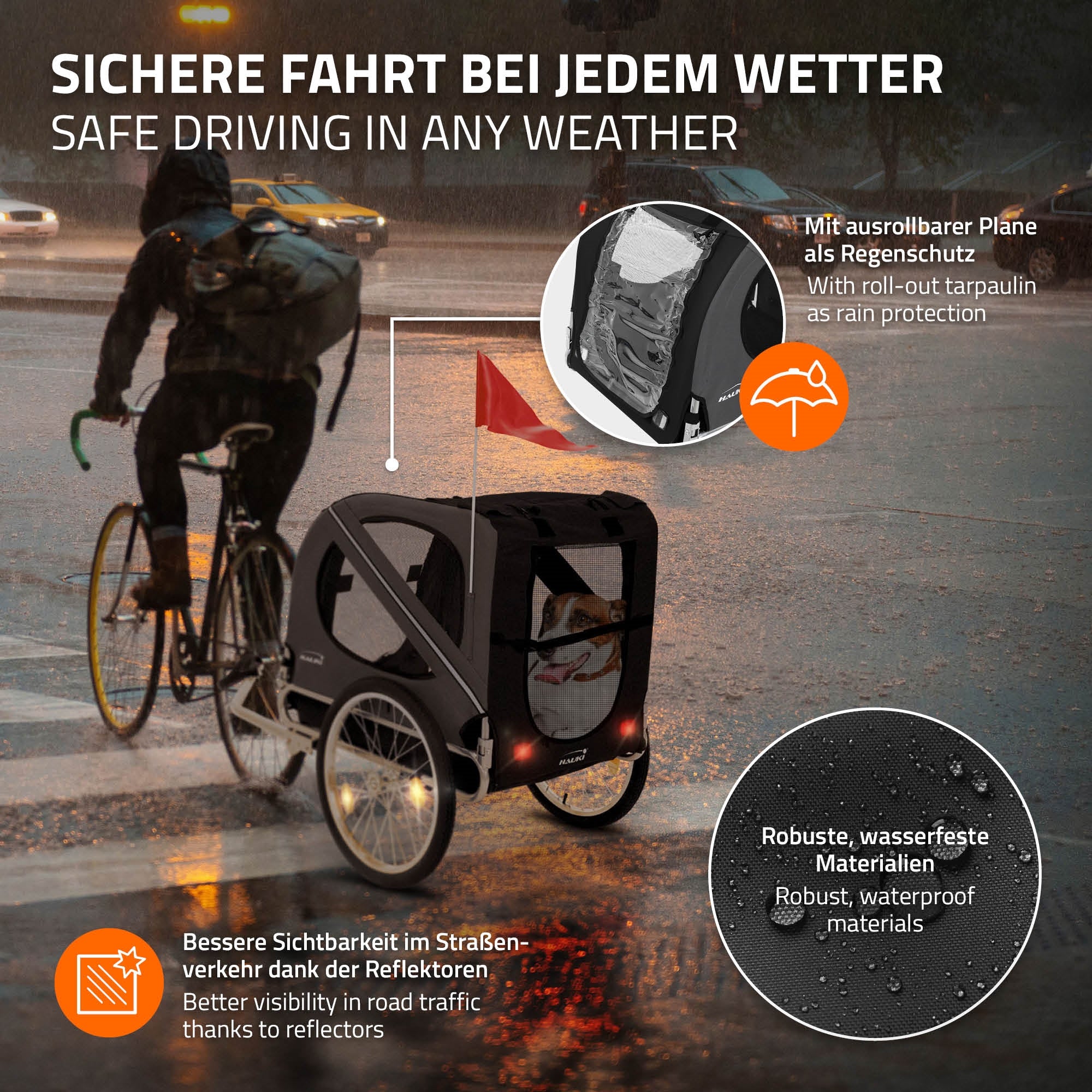 Fahrradanhänger bei Regen, mit ausrollbarer Plane und reflektierenden Elementen.