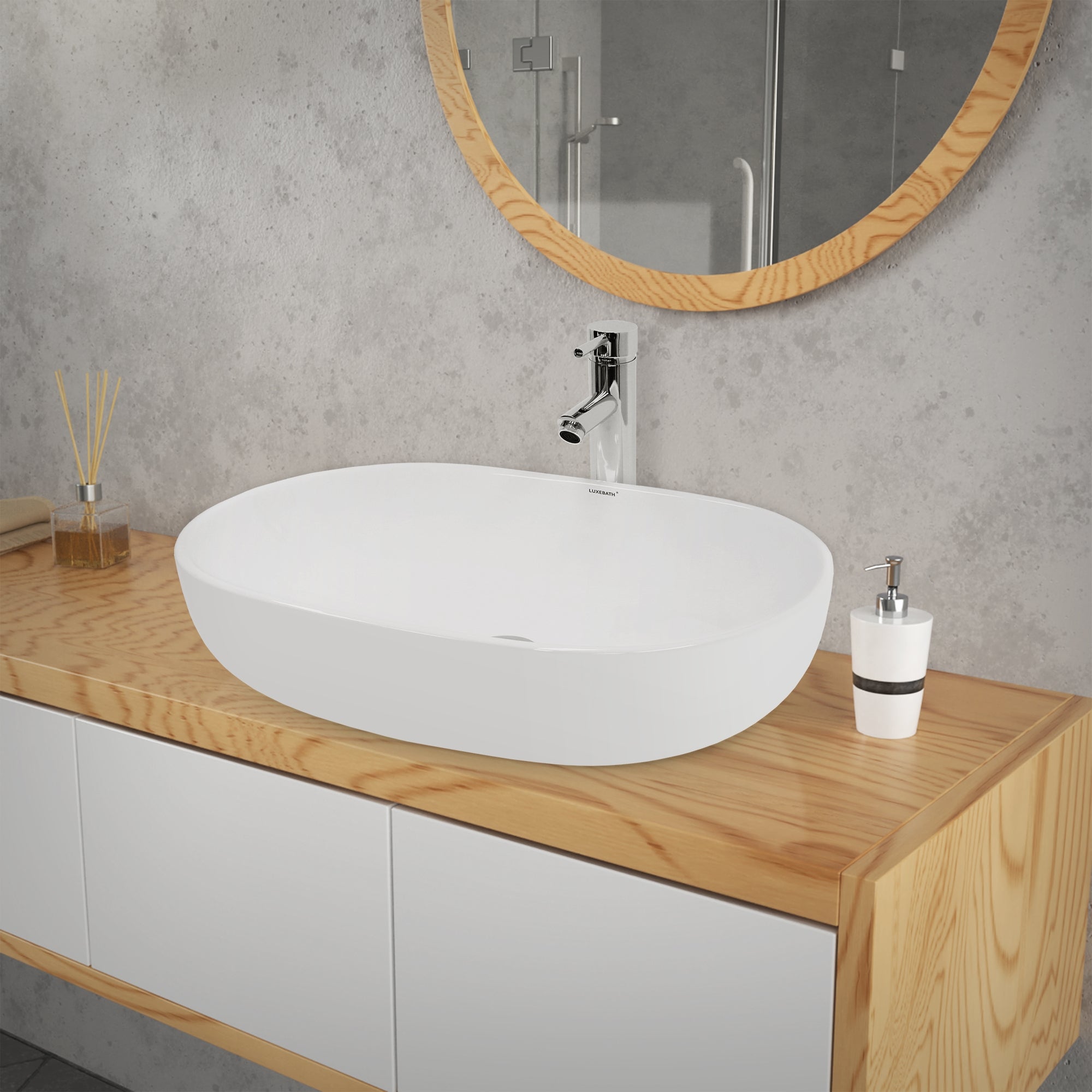 Round sink on a wooden dresser in front of a mirror.