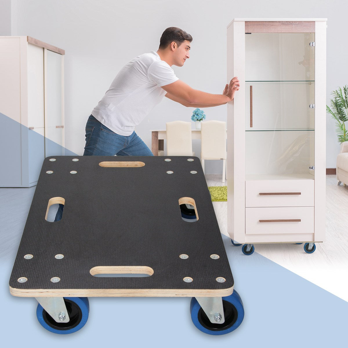 A man pushes a trolley carrying a shelving unit in a room with furniture.