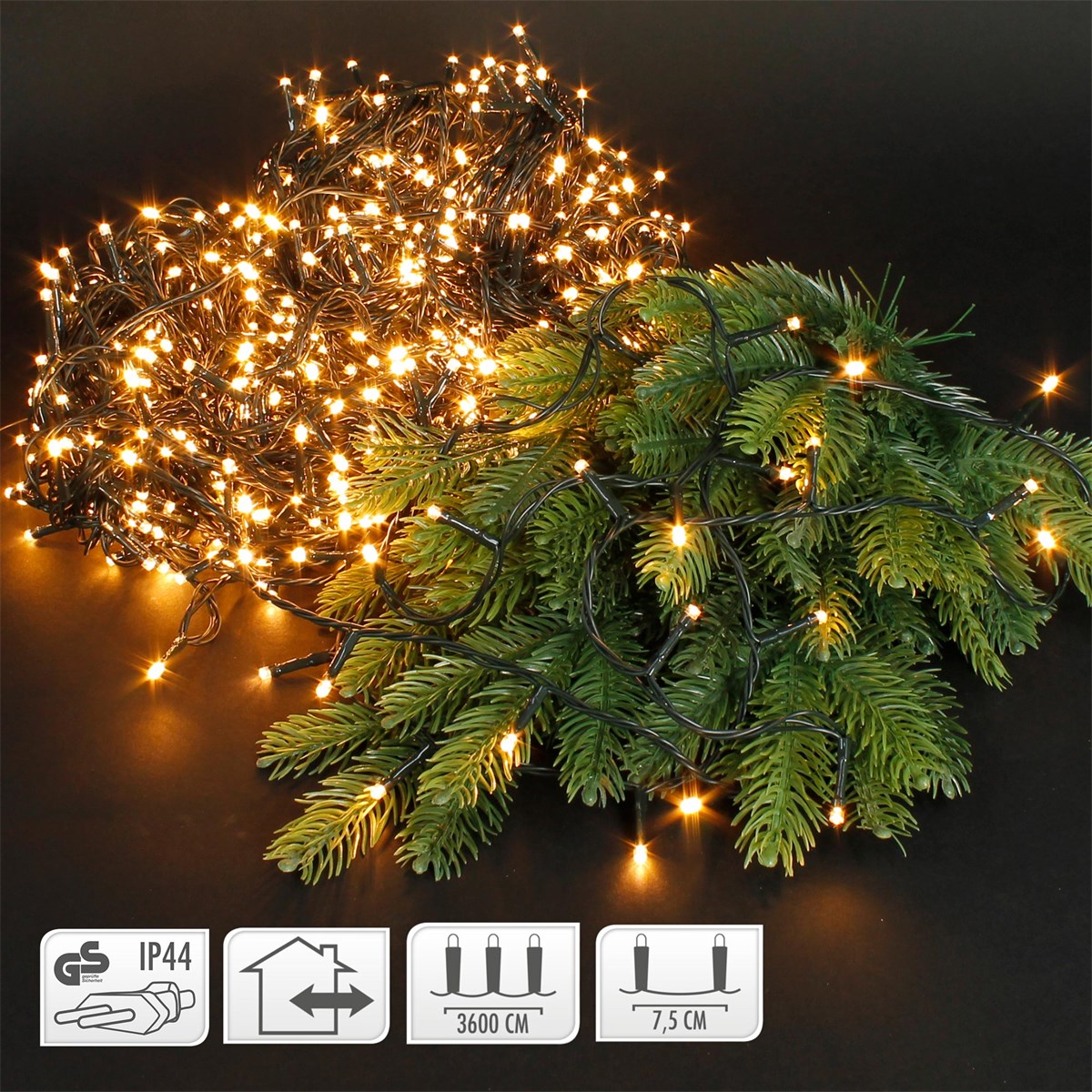 Lichterkette mit warmweißen LEDs und Tannenzweigen auf schwarzem Hintergrund.