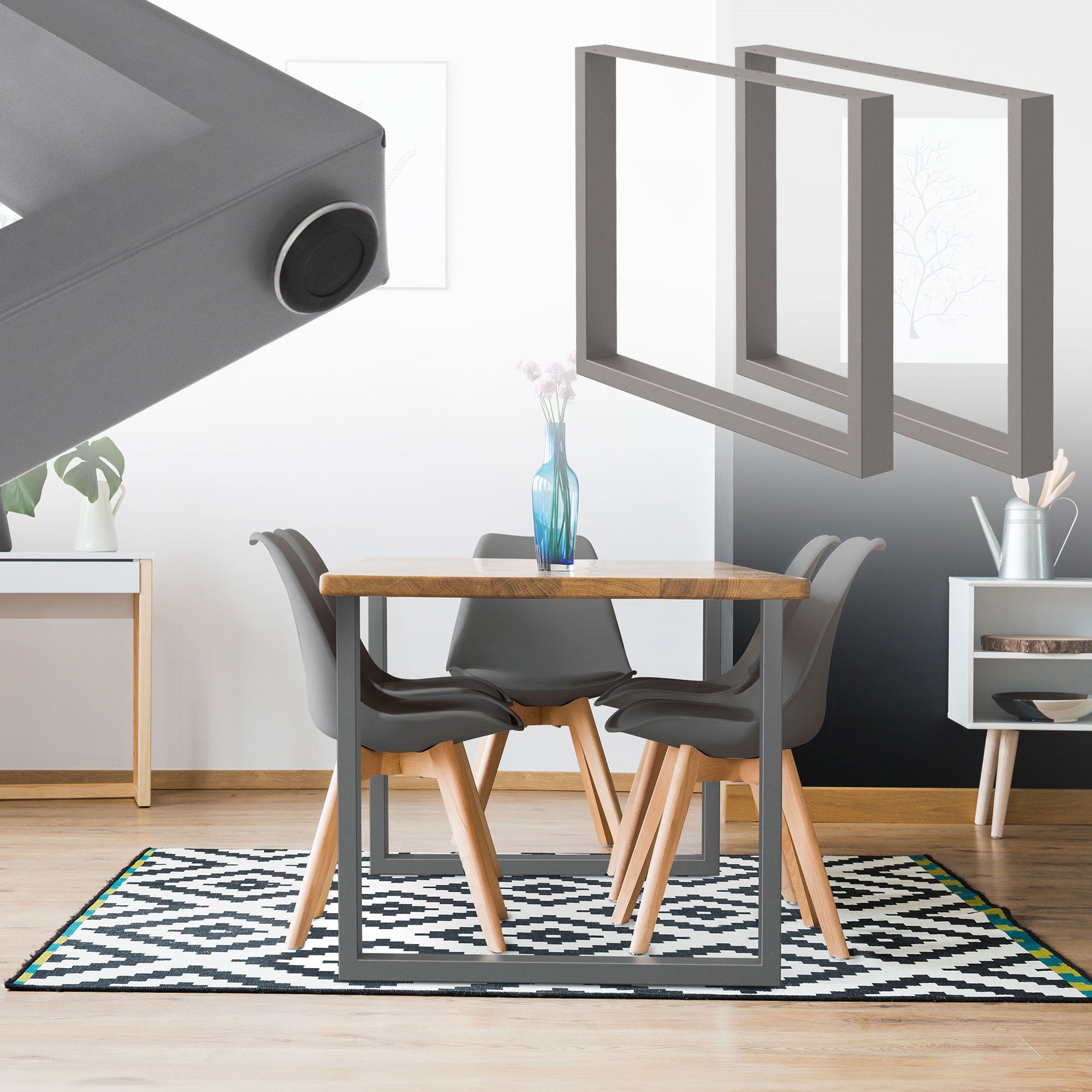 Esszimmer mit grauem Tisch und zwei grauen Rahmen im Hintergrund.