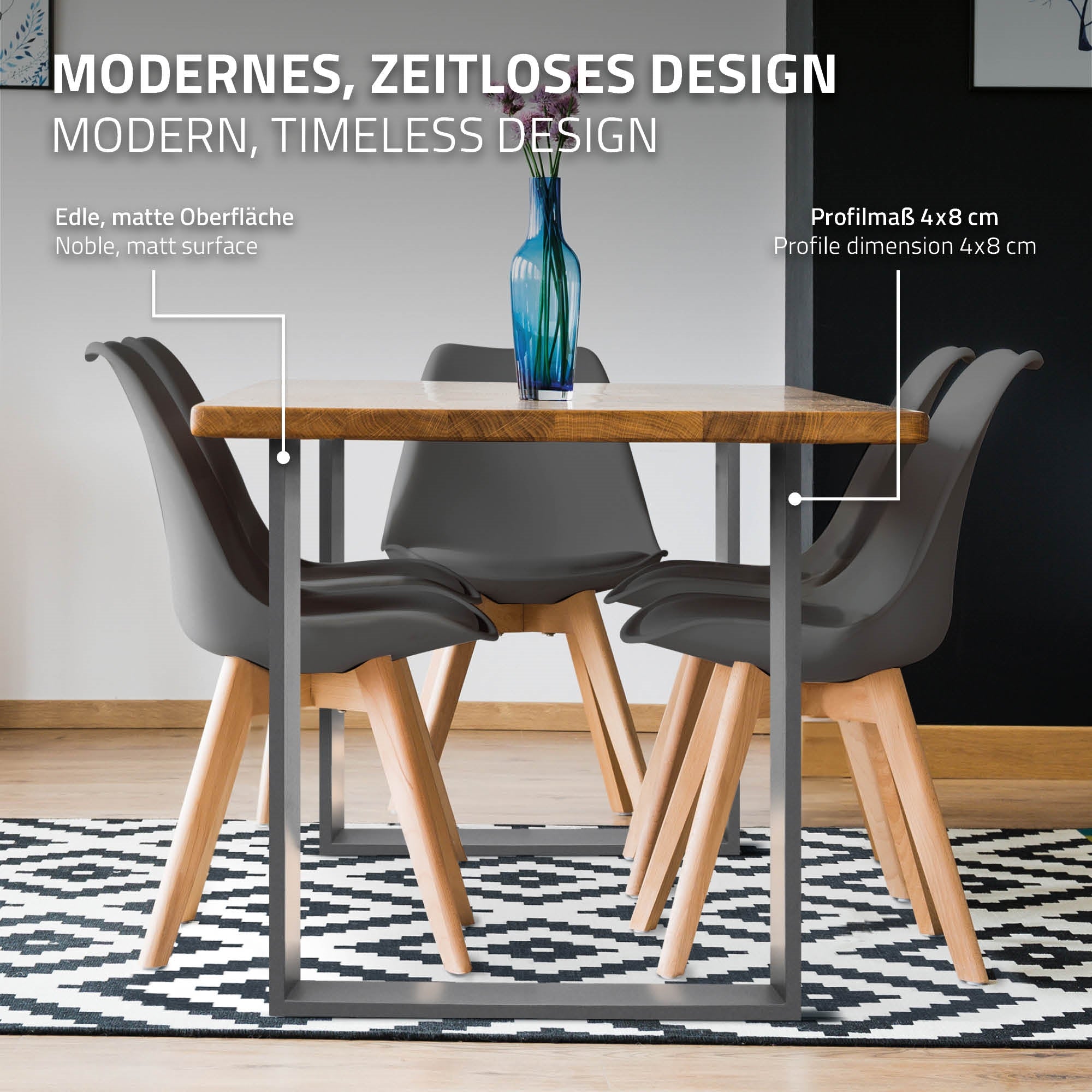 Une table avec des cadres gris et quatre chaises dans une pièce moderne.