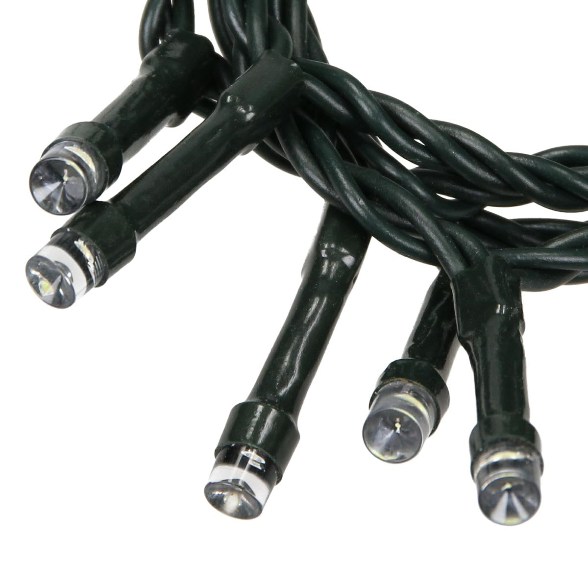 Close-up of LED lights on a green string of lights.
