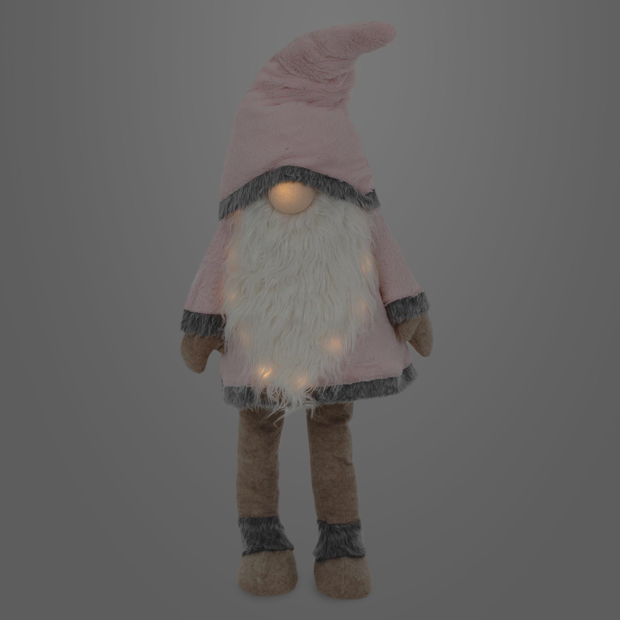 Plush figure of a gnome with a pink hat and glowing dots.