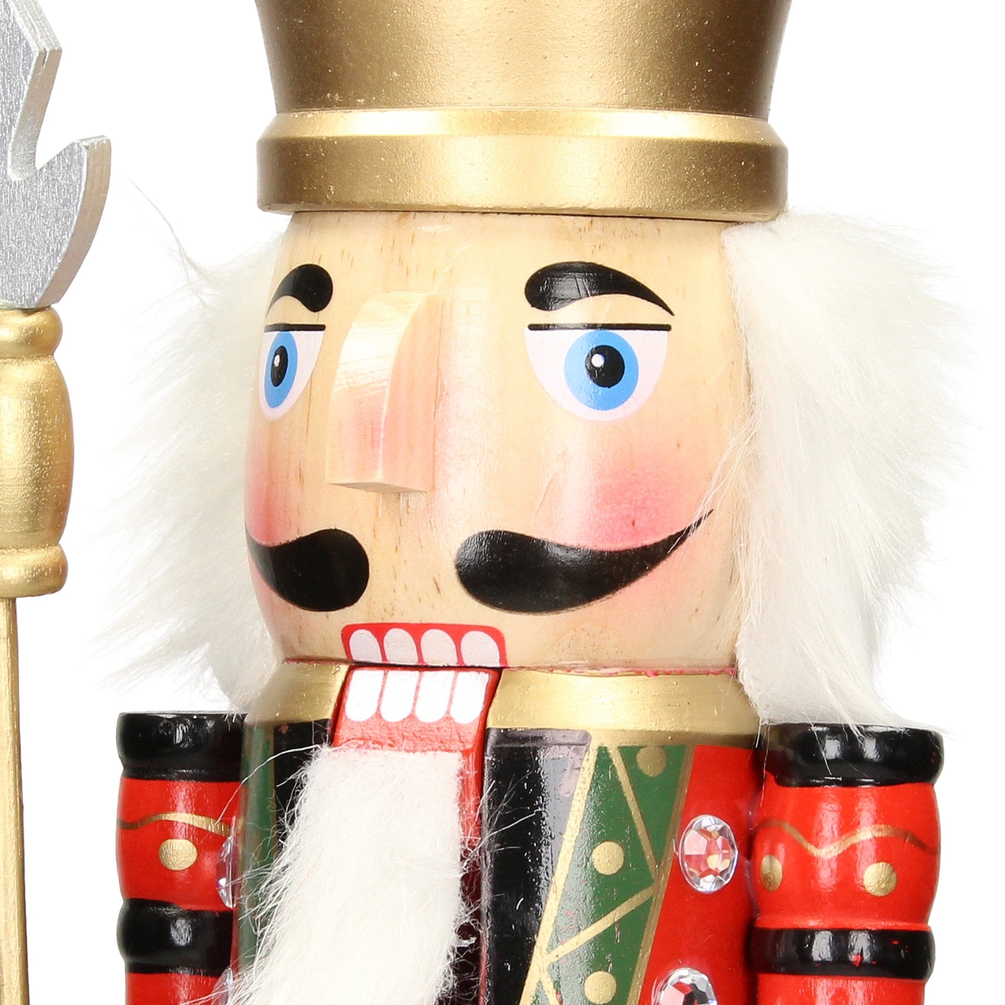 A detailed wooden nutcracker with a golden crown and colorful suit.