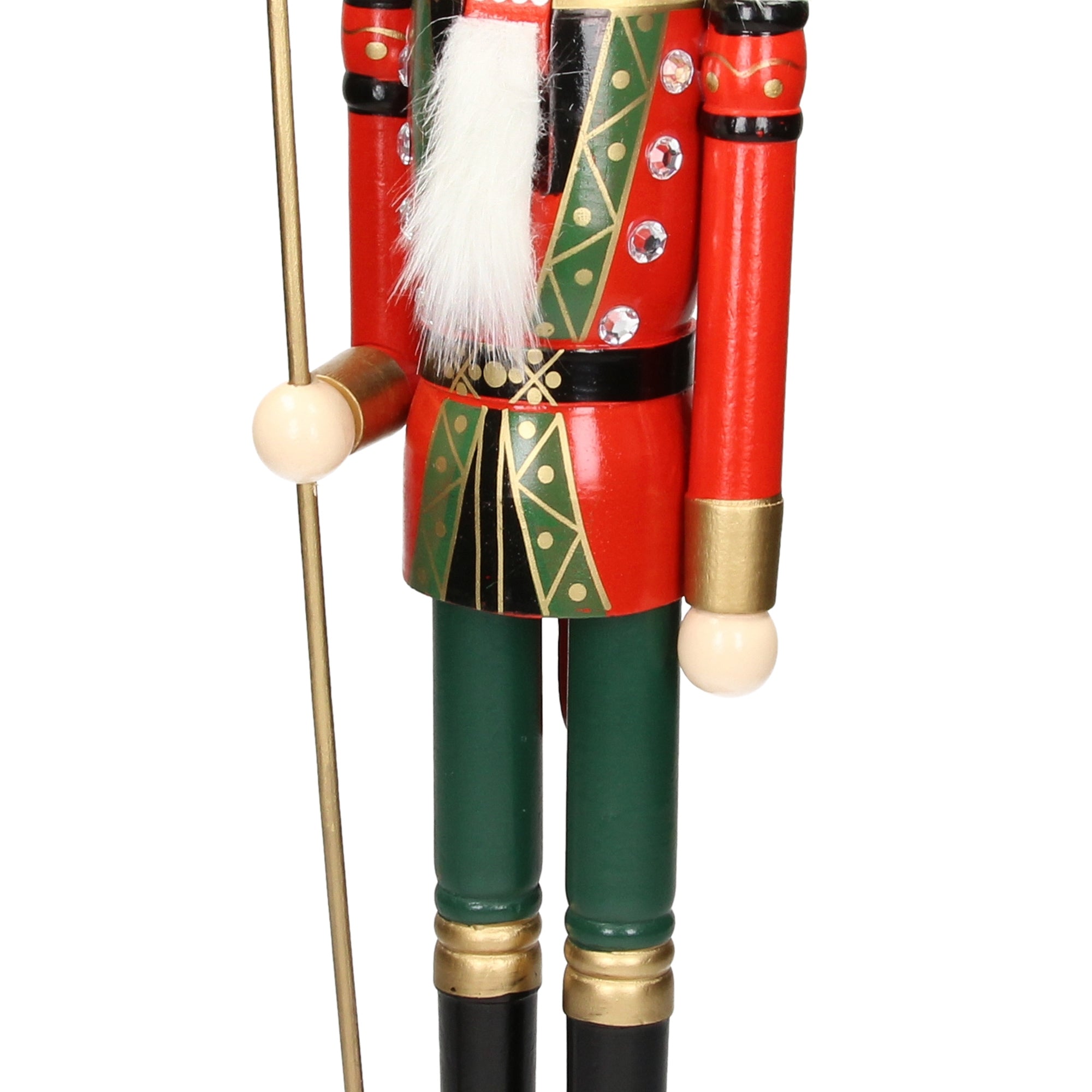 Close-up of a nutcracker with spear and green pants.
