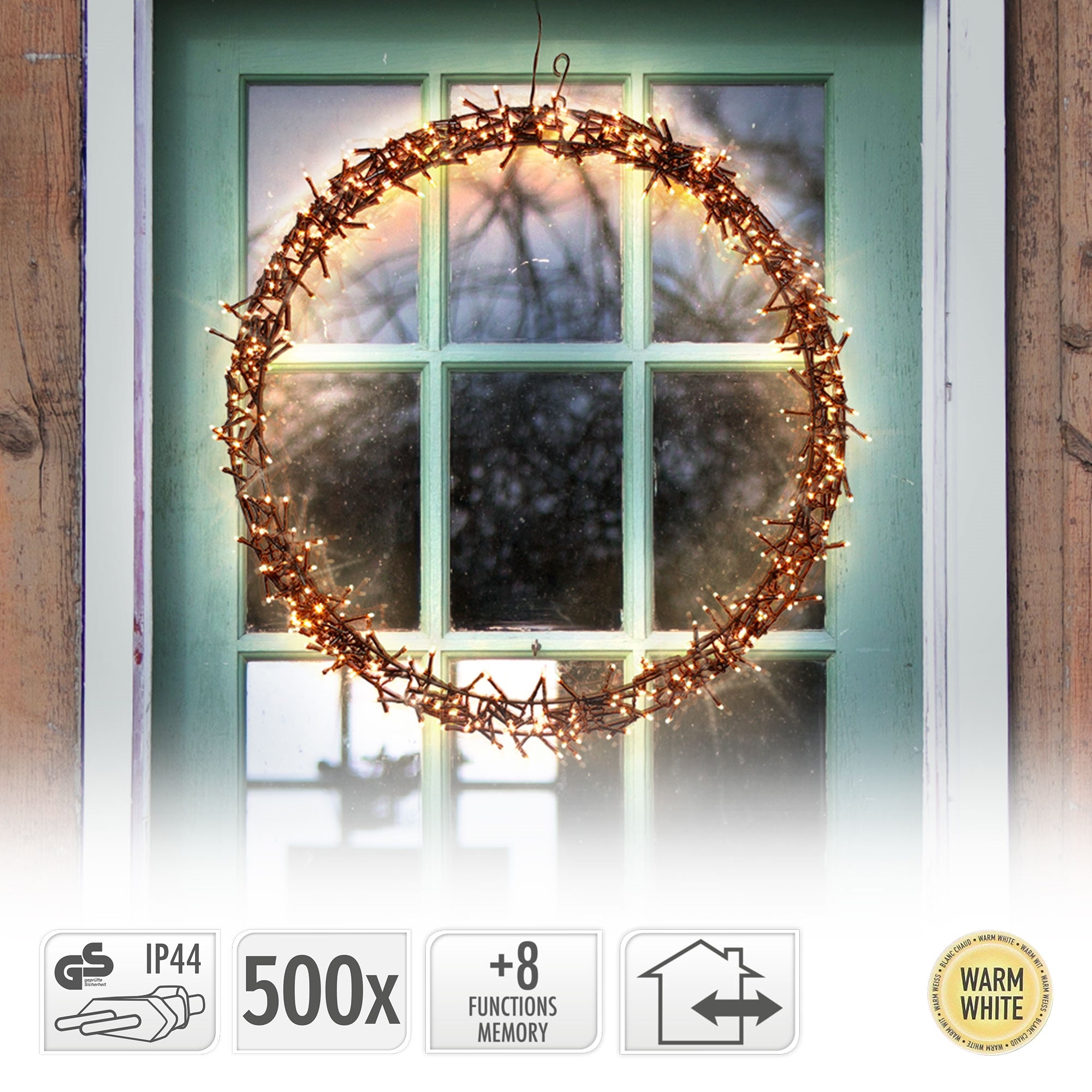 Ein beleuchteter Kranz an einer Tür mit grünem Rahmen und Funktionssymbolen.