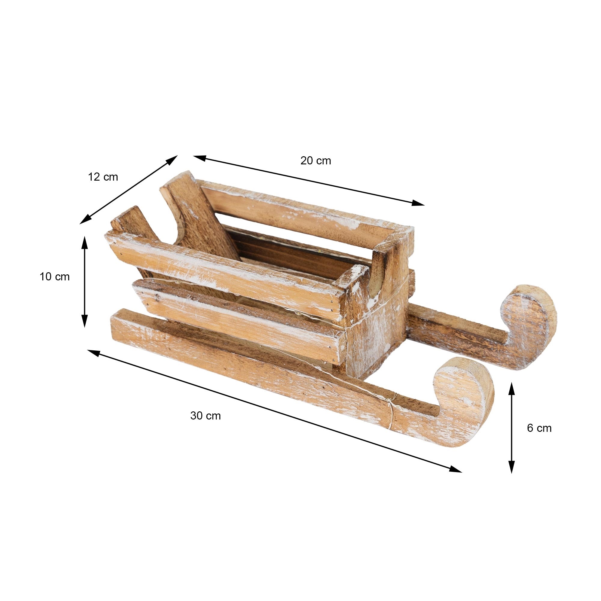 Un trineo de madera con medidas: 30 cm de largo, 20 cm de ancho, 12 cm de alto.