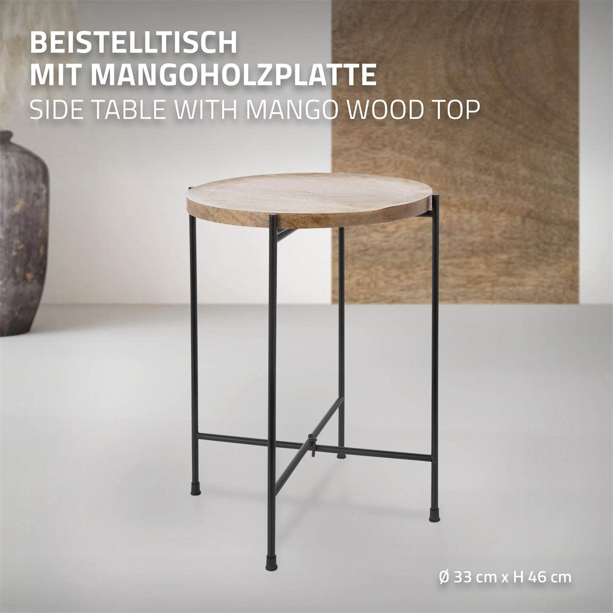Beistelltisch mit runder Mangoholzplatte und schwarzem Metallgestell.