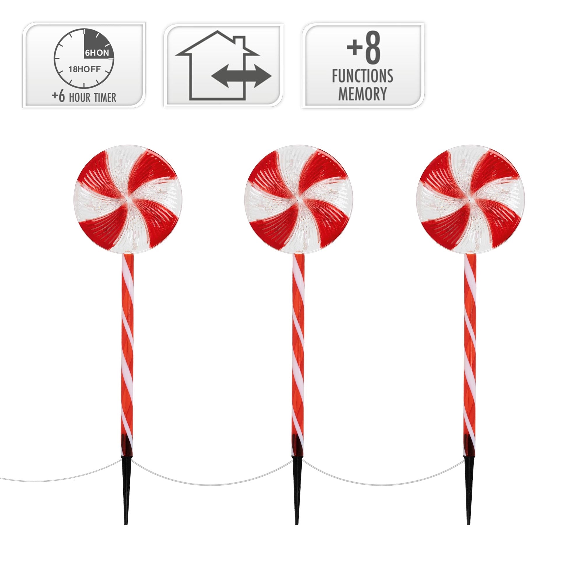 Tres decoraciones de piruletas rojas y blancas en palos.