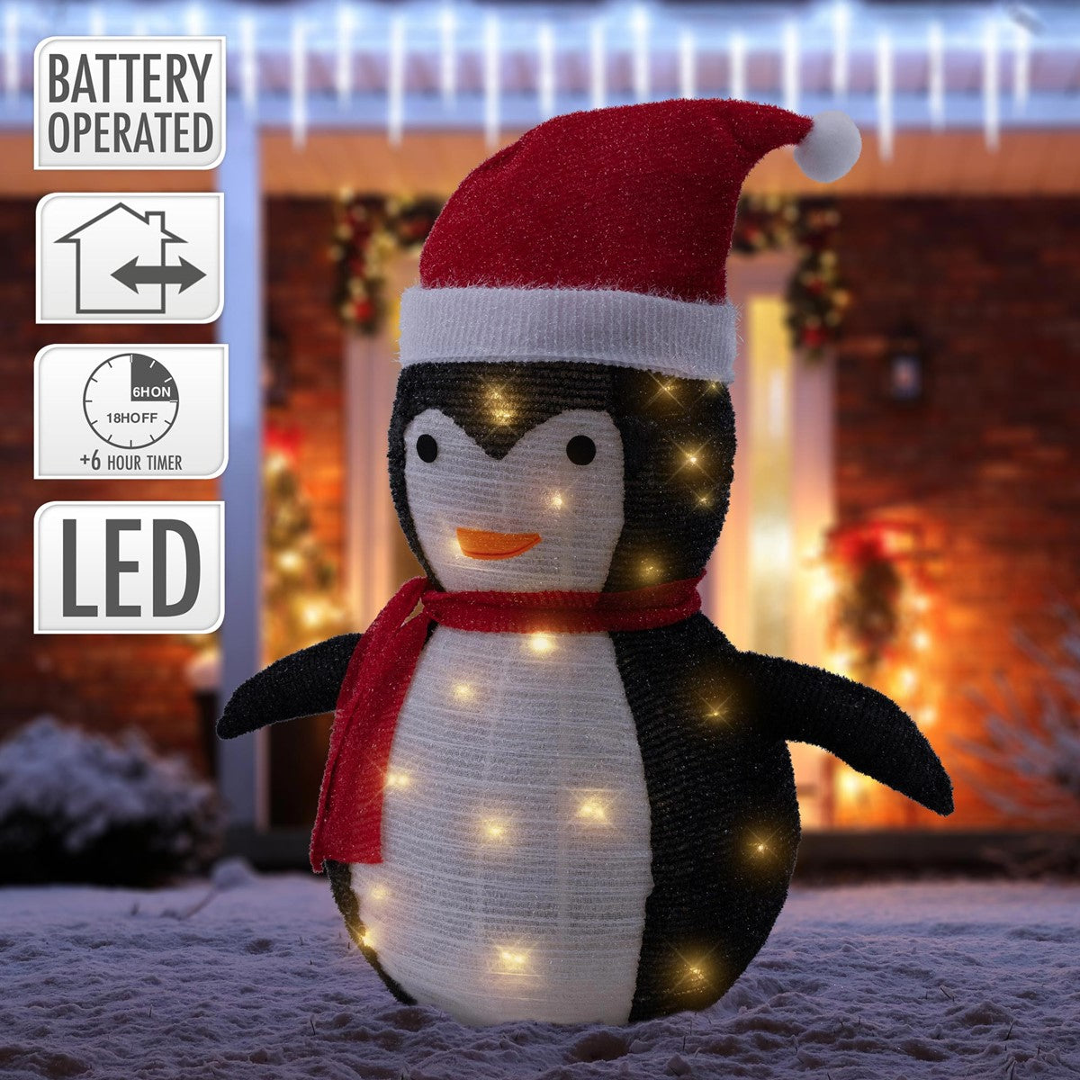 Pinguino decorativo con cappello natalizio e luci LED.