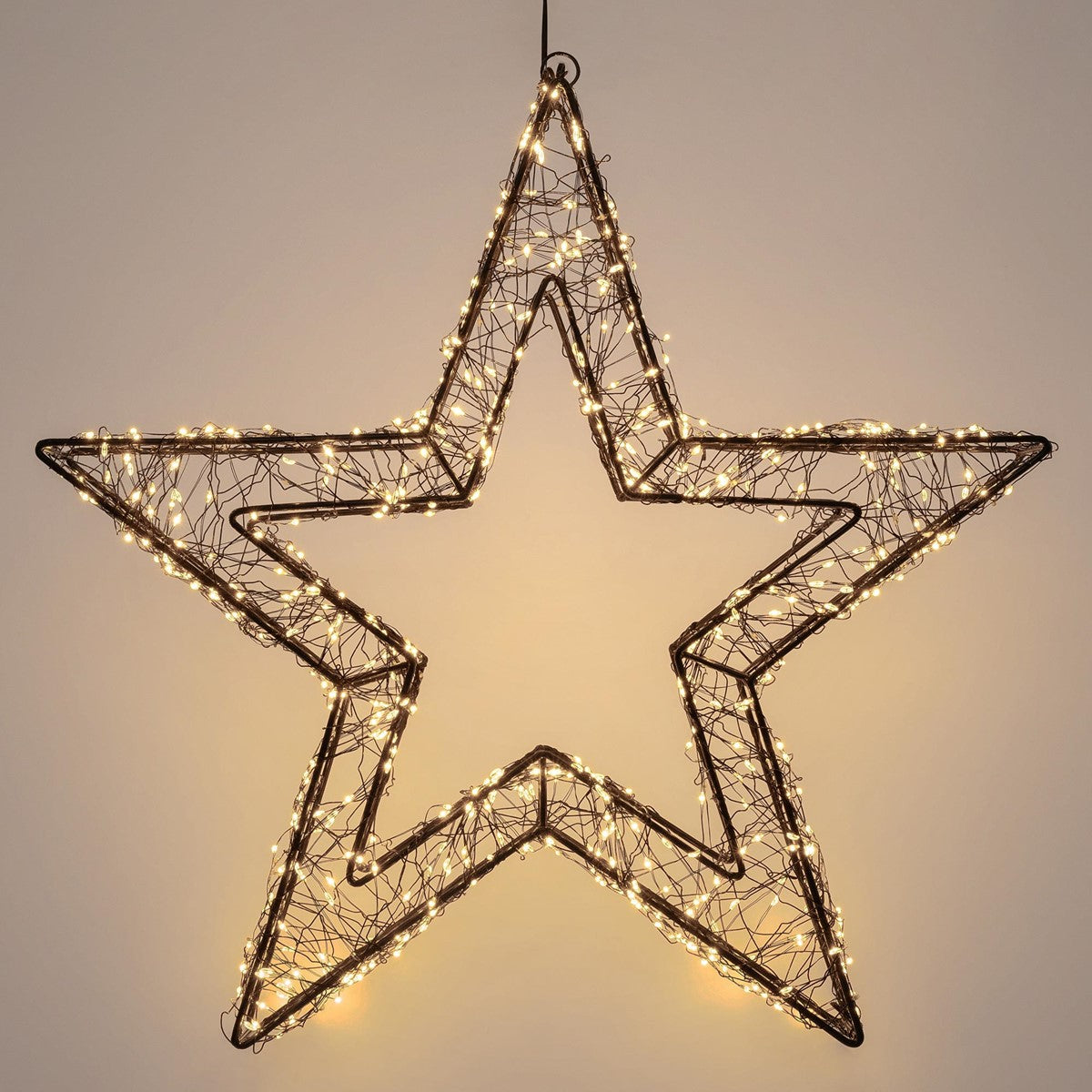 Una estrella luminosa de alambre sobre un fondo liso.