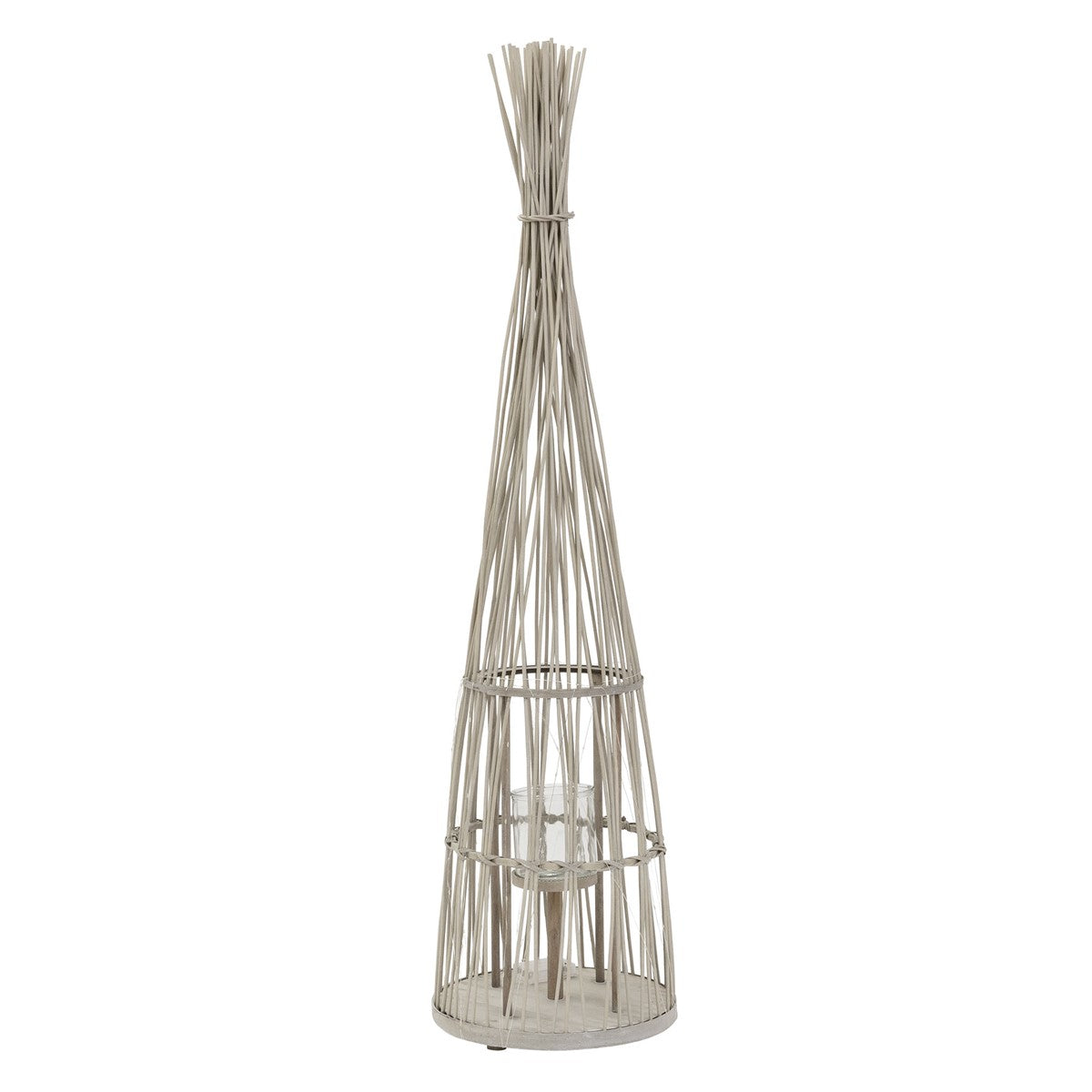 A tall rattan lantern with a glass container in the middle.