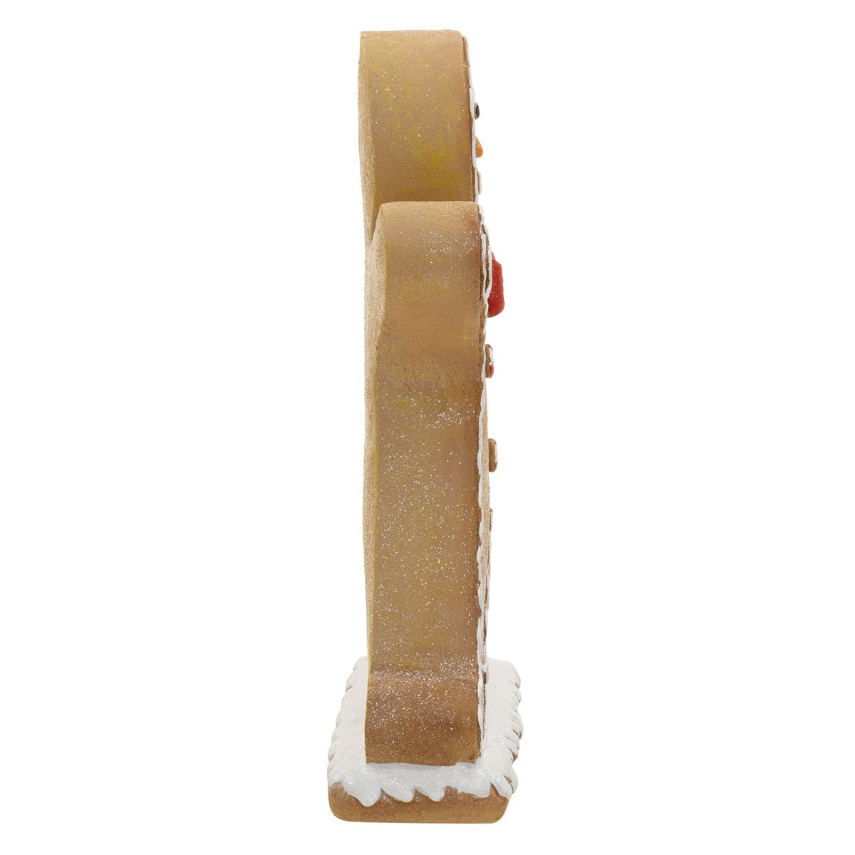 Seitenansicht eines Lebkuchenmanns mit rotem Schal und Mütze.