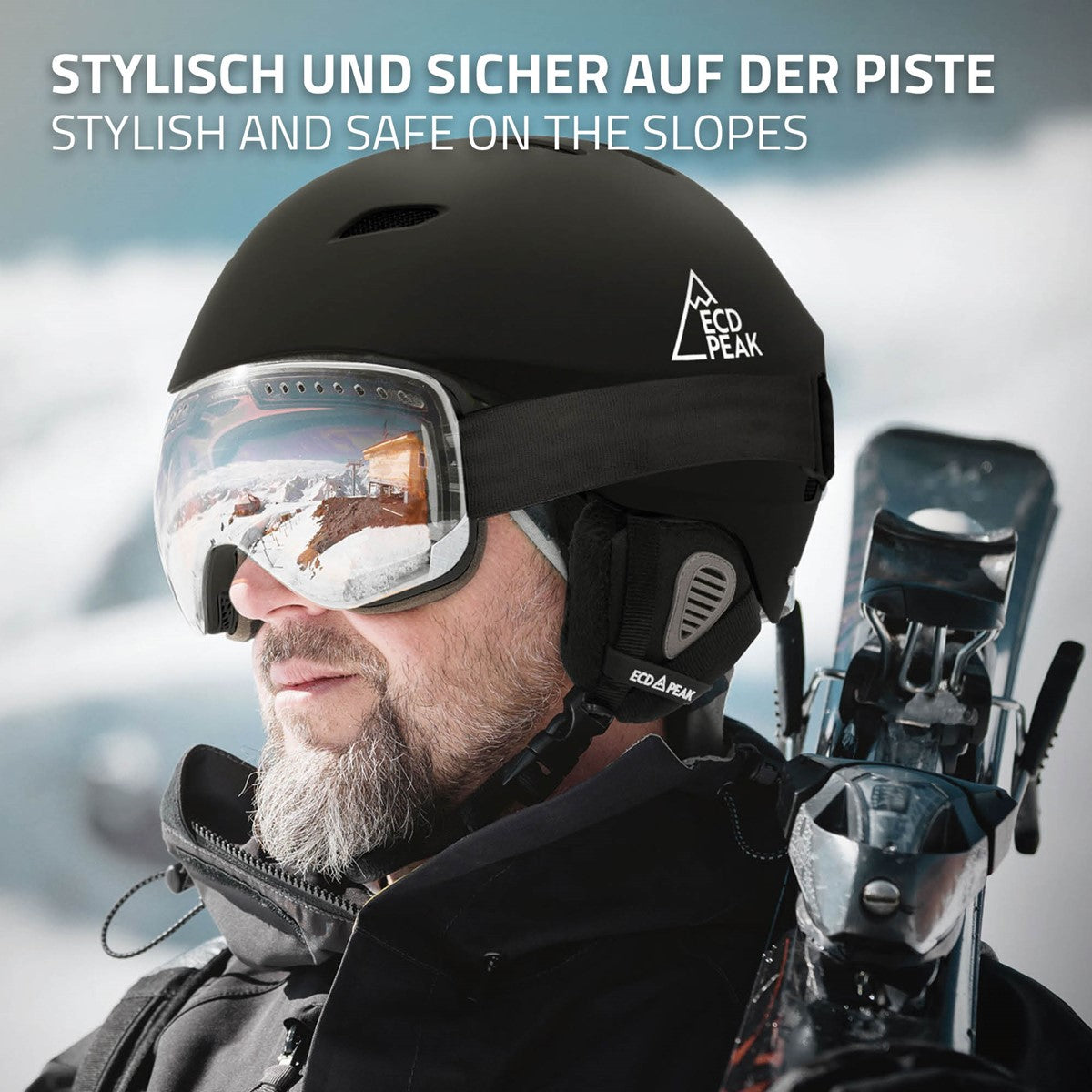 Mann mit schwarzem Skihelm und Skibrille auf einer Piste.