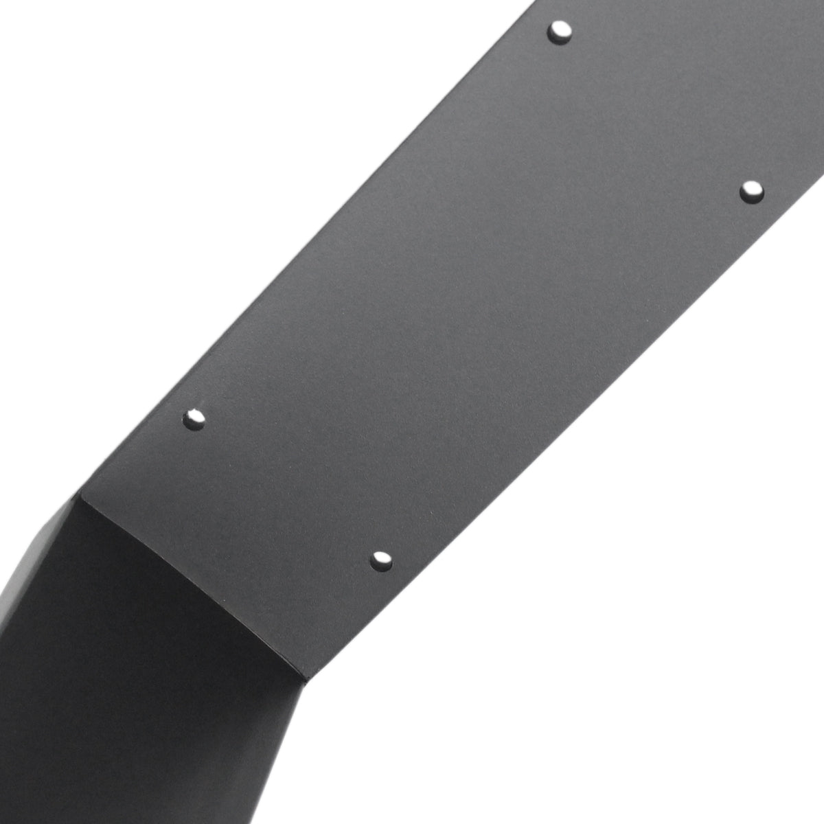 Close-up of a metal part with pre-drilled holes.