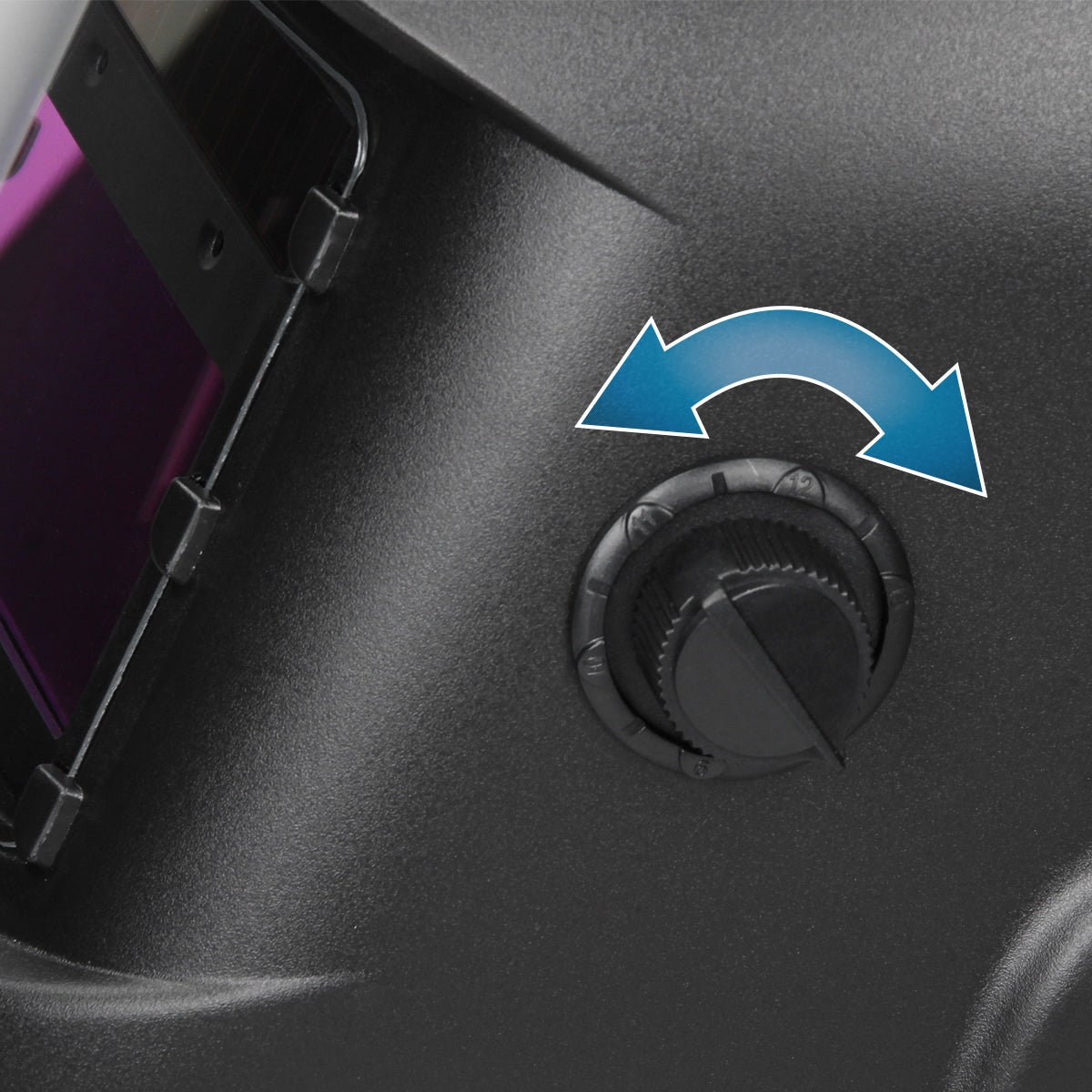 Control knob on a device with arrows for adjustment.