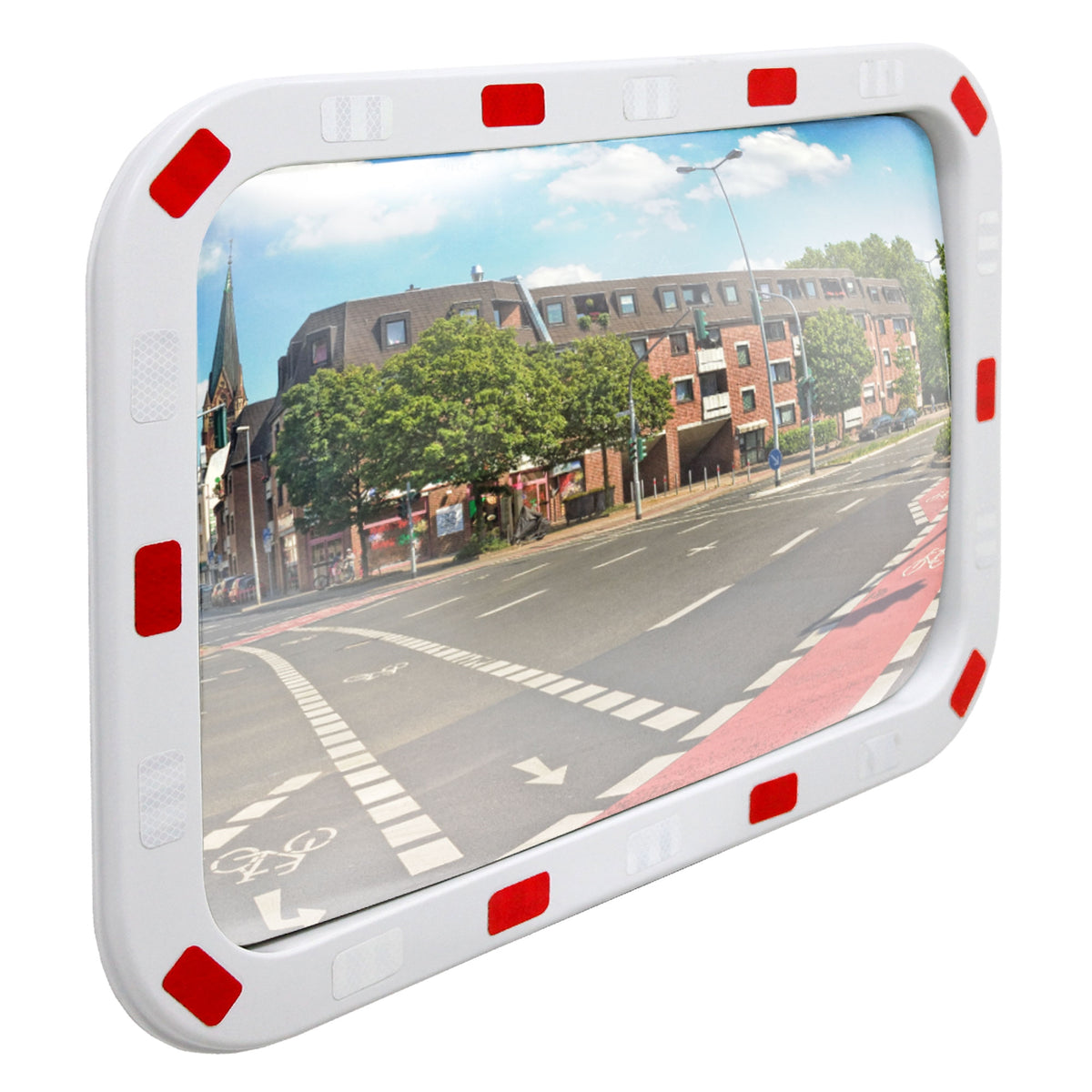 Traffic mirror with a red border, showing a road with trees and buildings.