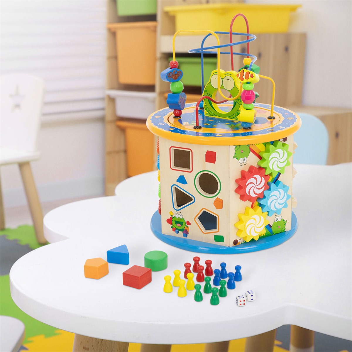 Colourful toy table with various shapes and colours on a table.