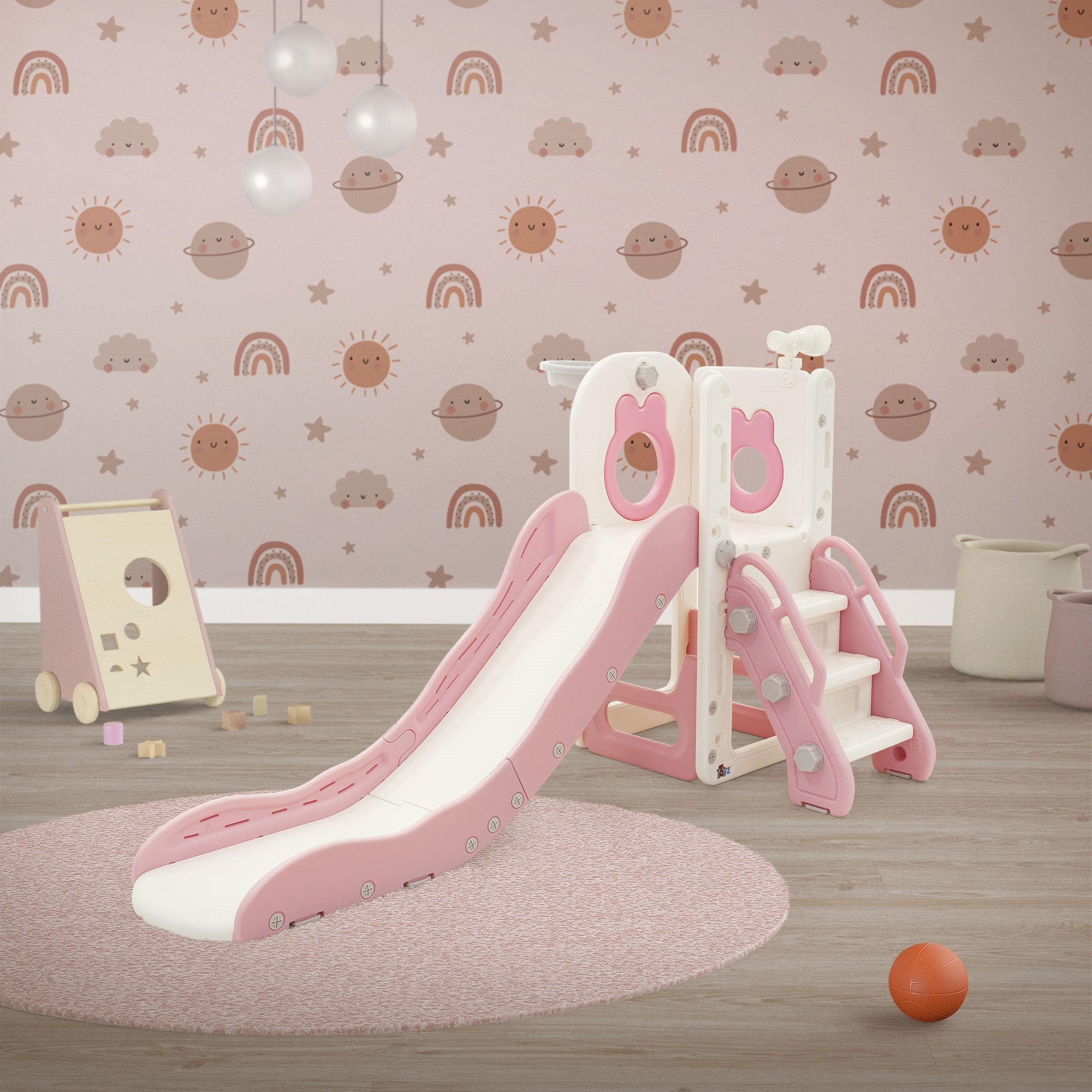 Kinderrutsche mit Treppe und pinken Akzenten in einem Raum mit buntem Wanddesign.