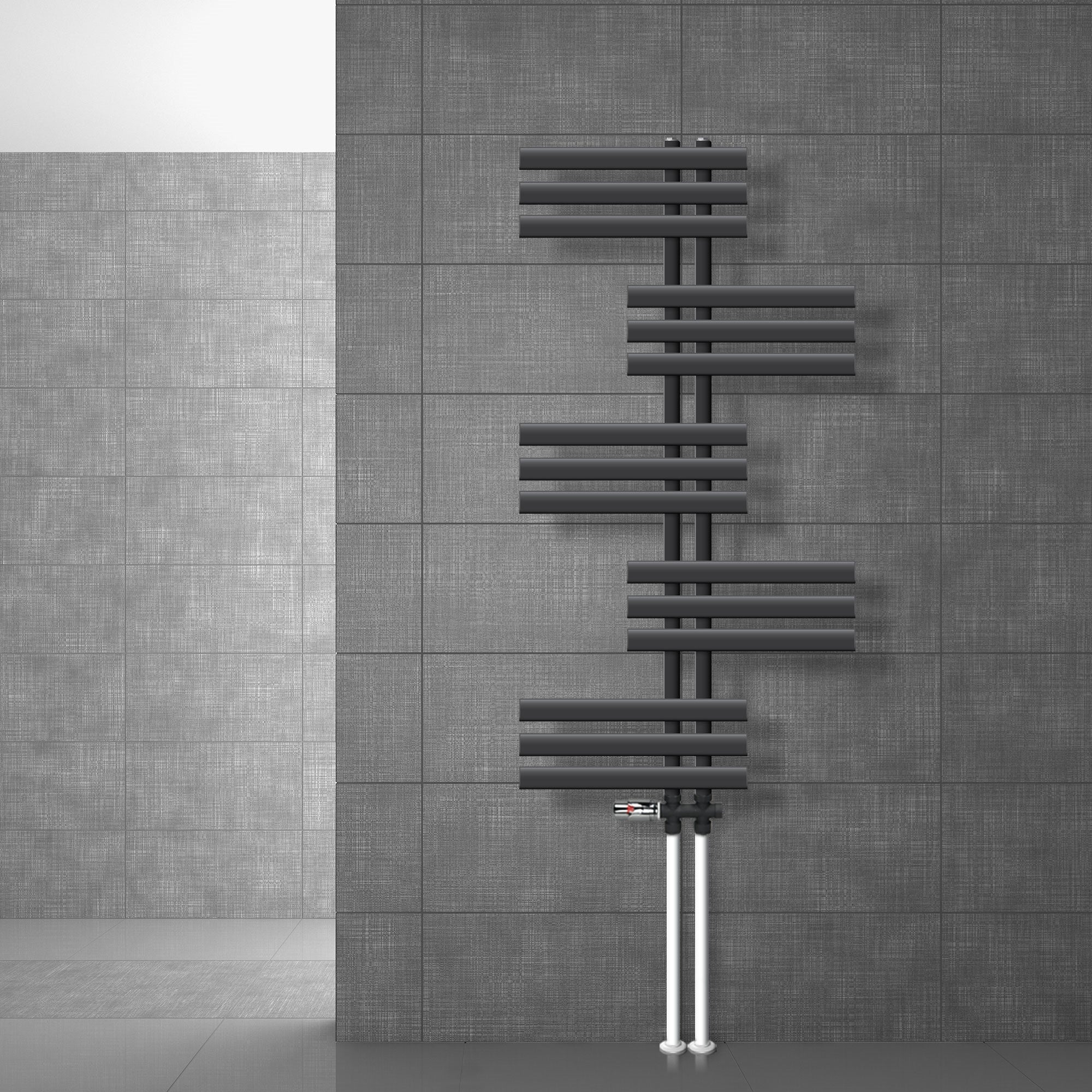 Anthracite radiator on a gray wall.