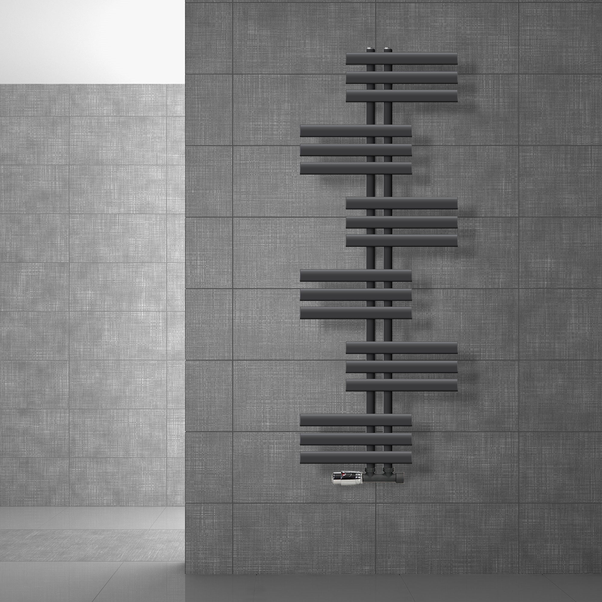 Anthracite radiator on a gray wall.