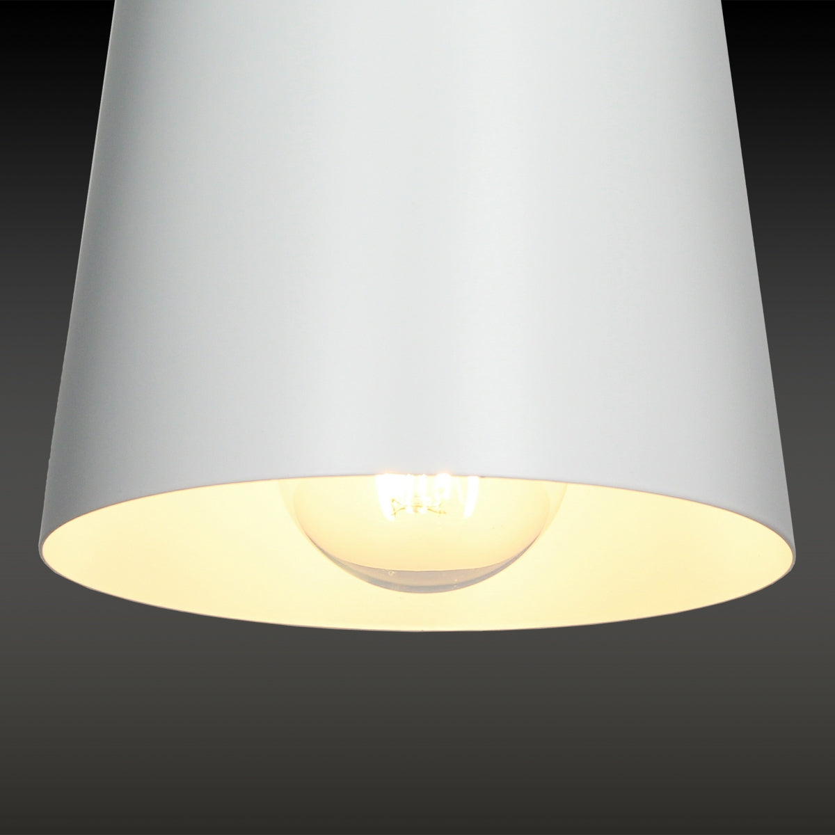 White lampshade with visible light bulb.