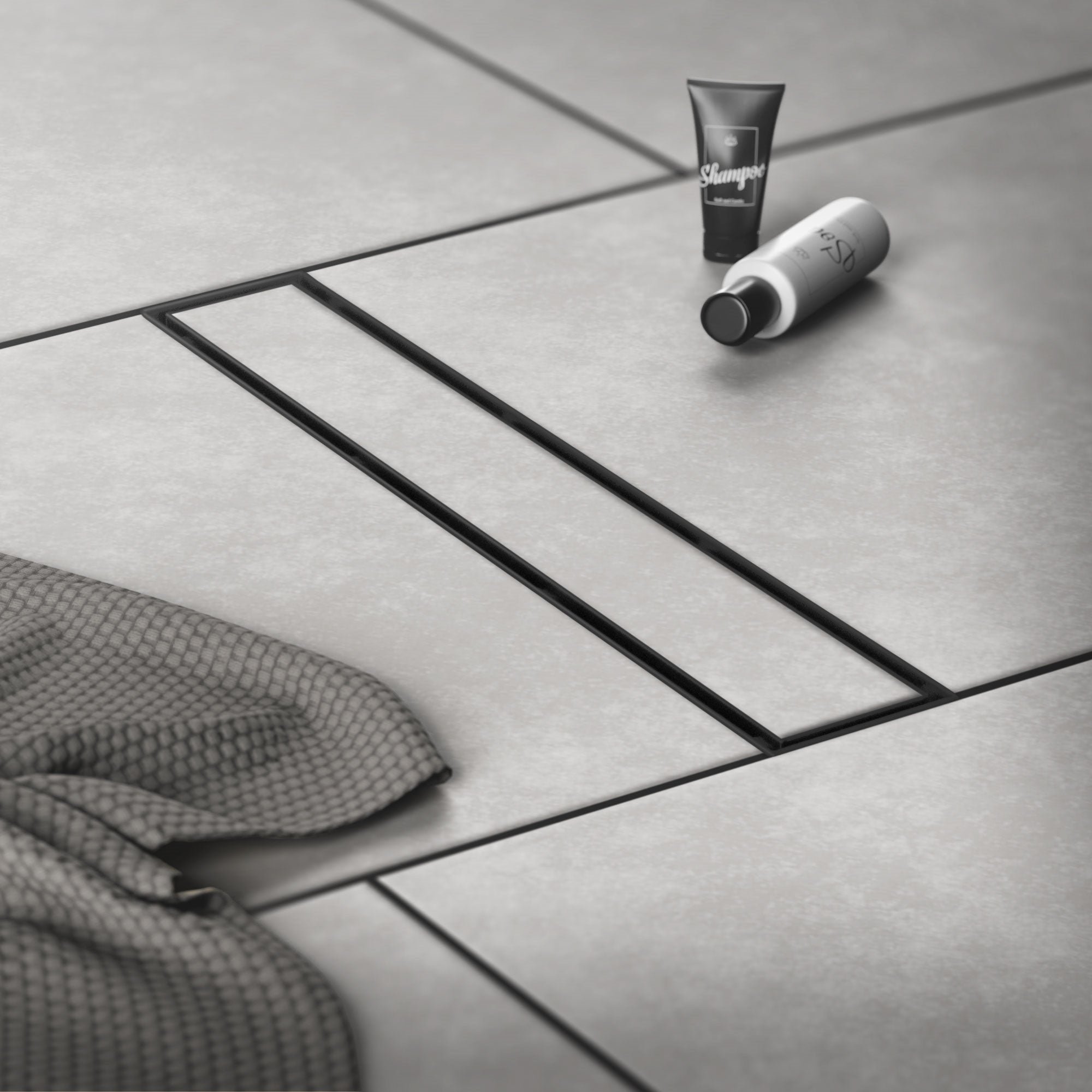 Glatte Fliesen mit einem Handtuch und zwei Pflegeprodukten darauf.