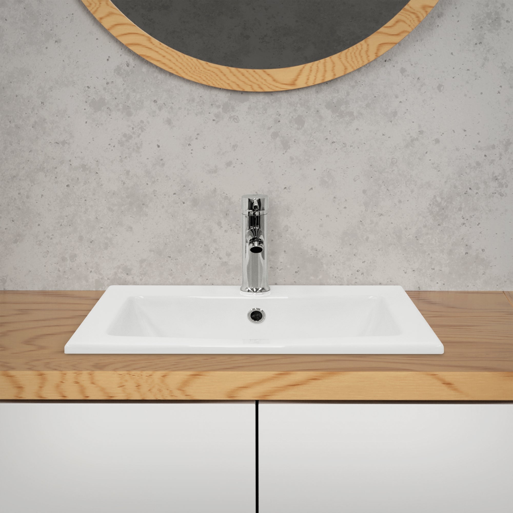 Sink on a wooden cabinet with a round mirror in the background.