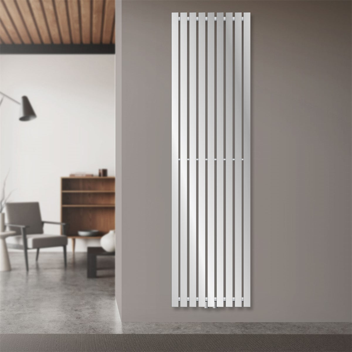 Light-colored vertical radiator in chrome with narrow fins.
