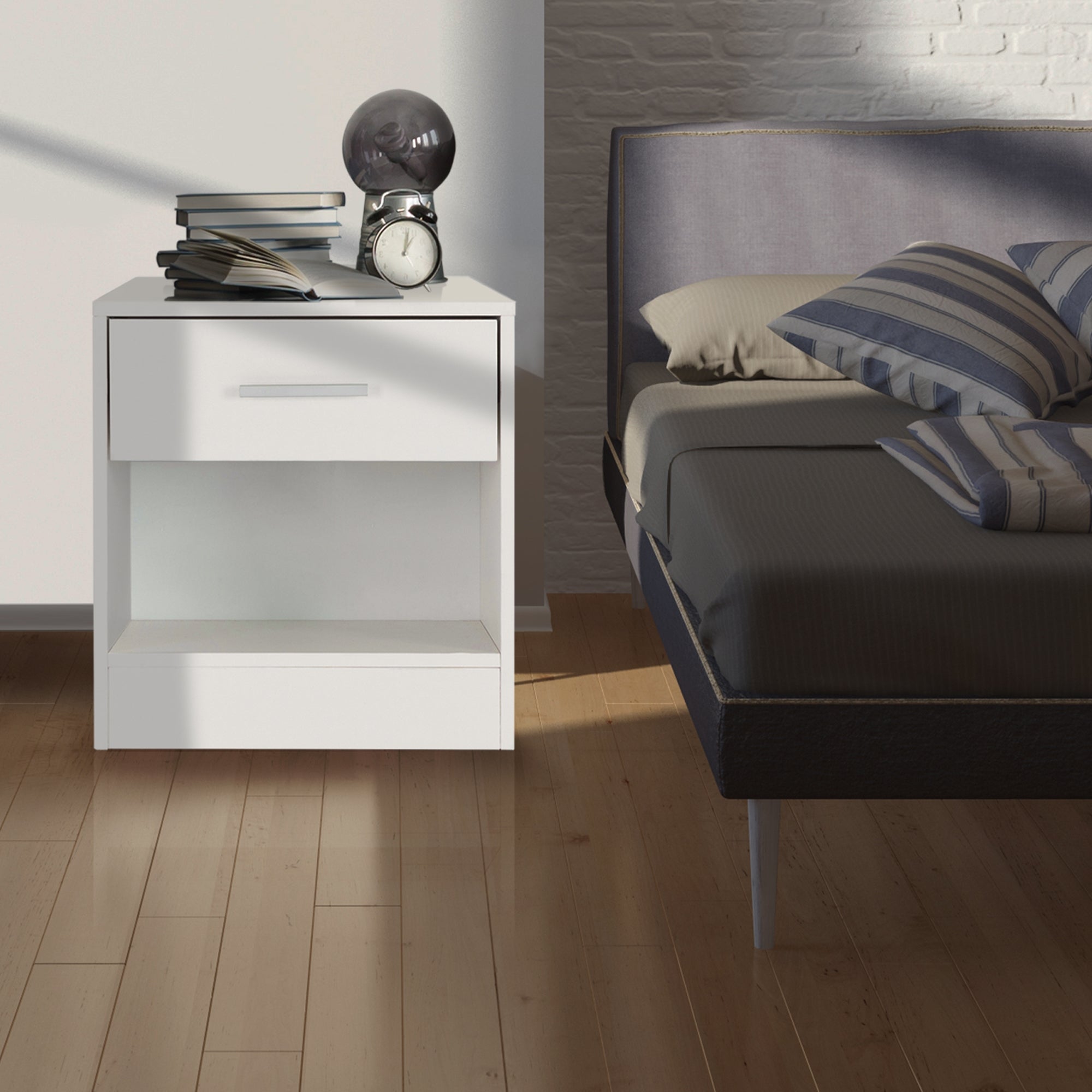 Nightstand with one drawer and an open compartment next to a bed.