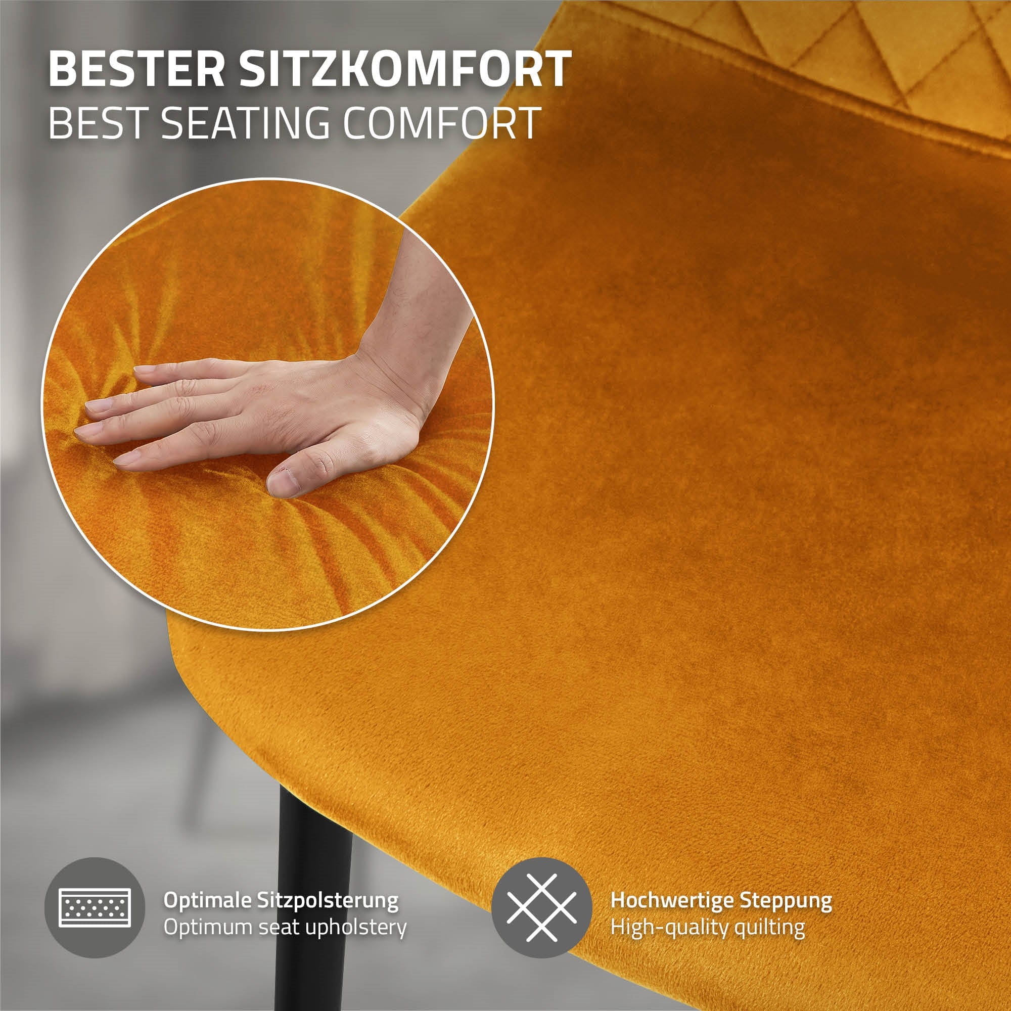 Nahaufnahme einer orangefarbenen Stuhlpolsterung mit Hand darauf.