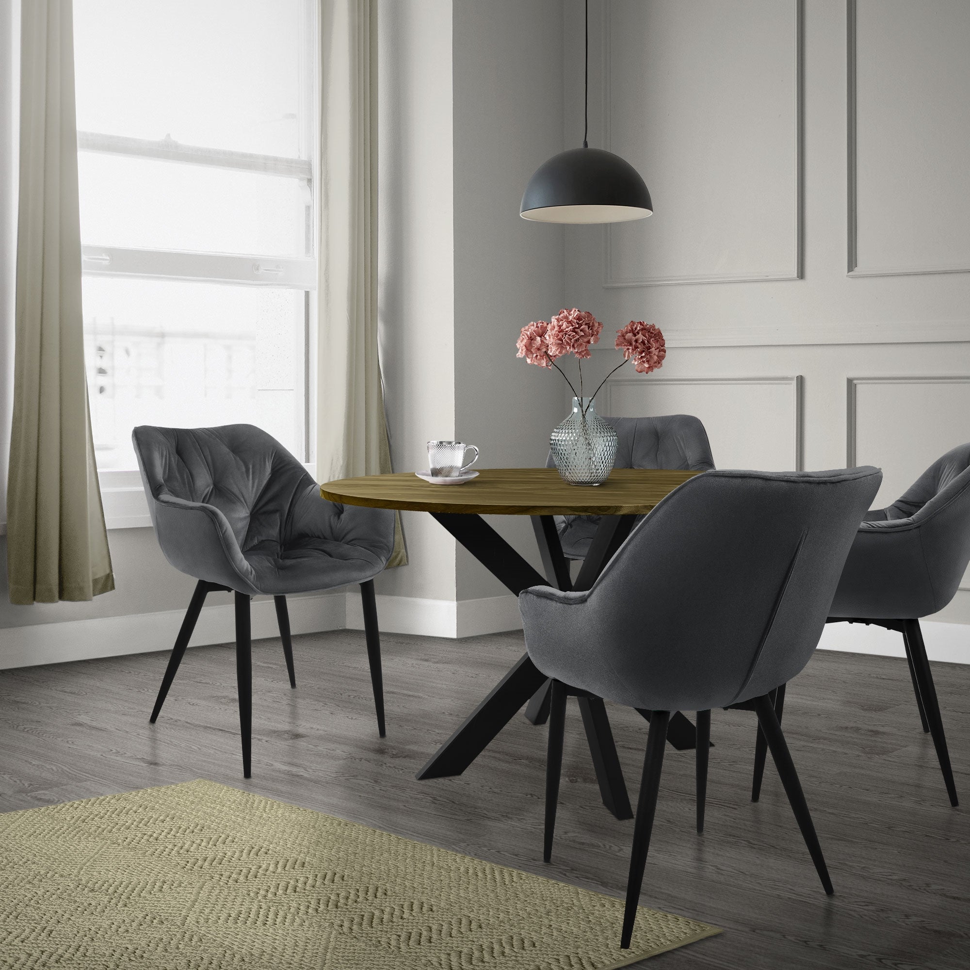 Dining area with a round wooden top, four gray chairs, and a lamp.
