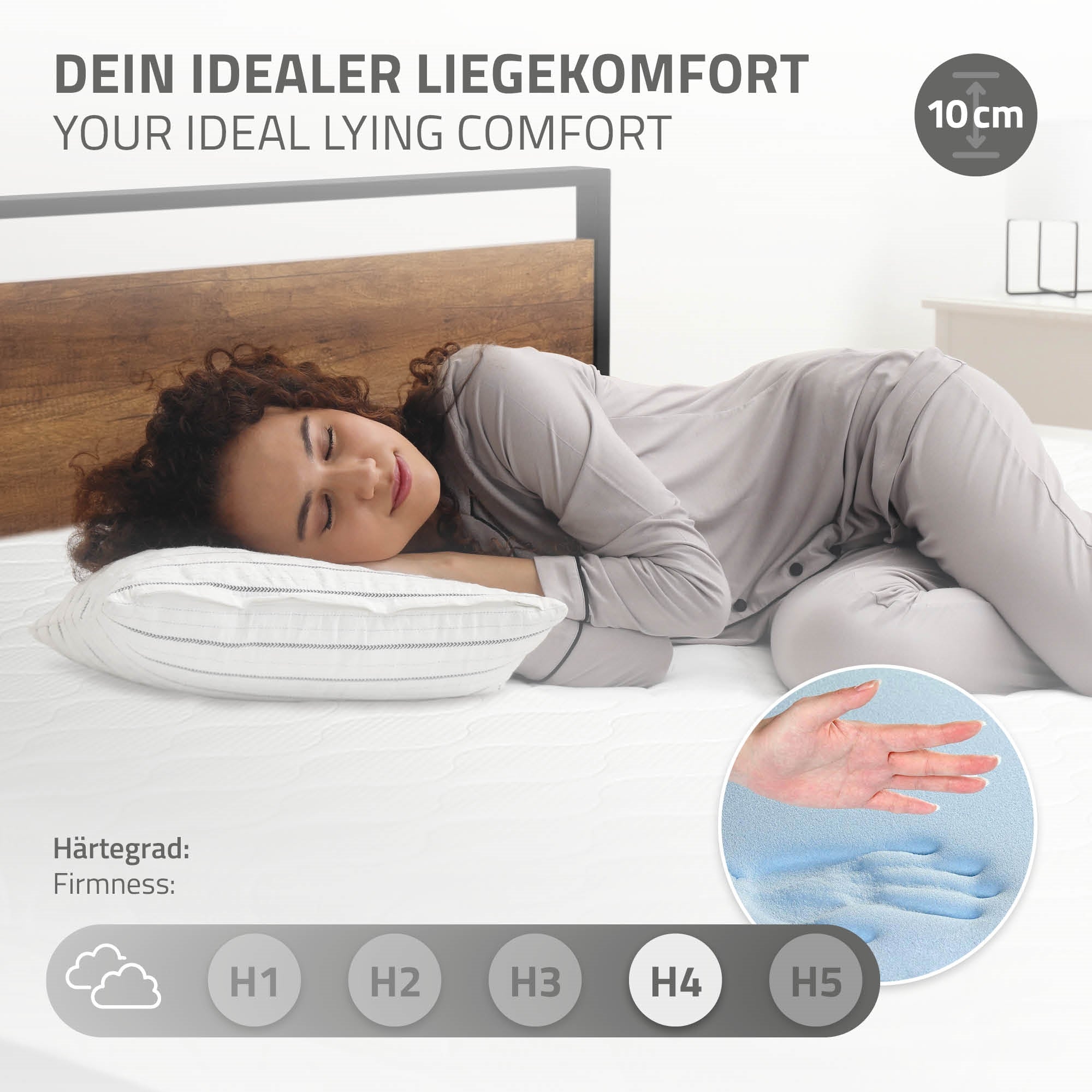 Eine Person liegt auf einer Matratze und nutzt ein Kissen.