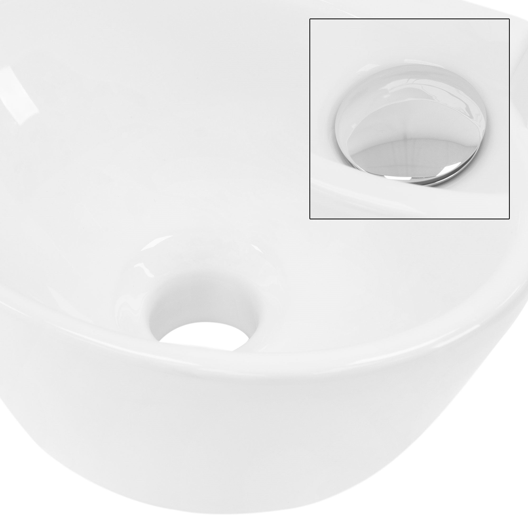 White sink with drain hole and shiny cover plug.