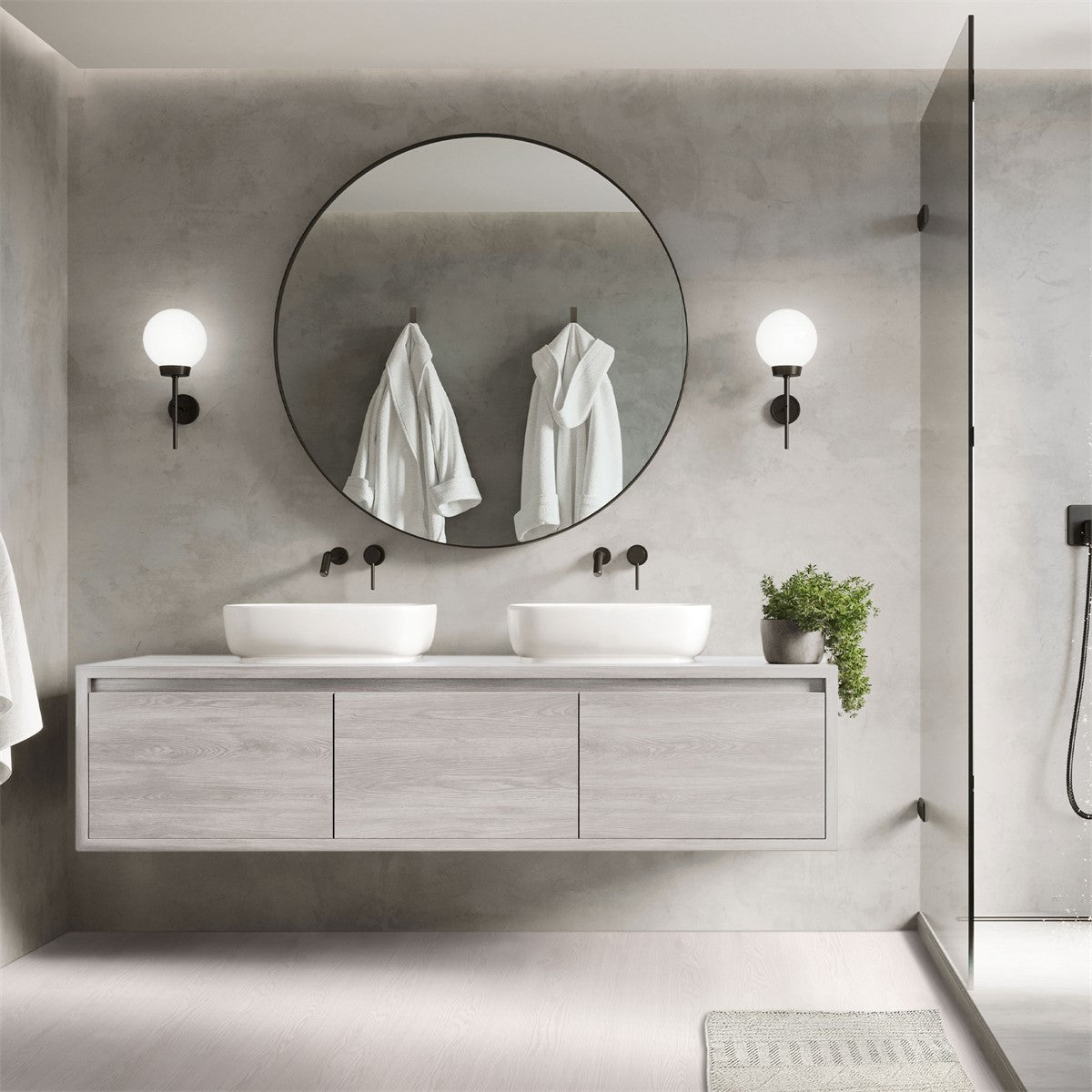 Modernes Badezimmer mit runden Spiegel und zwei Waschbecken.