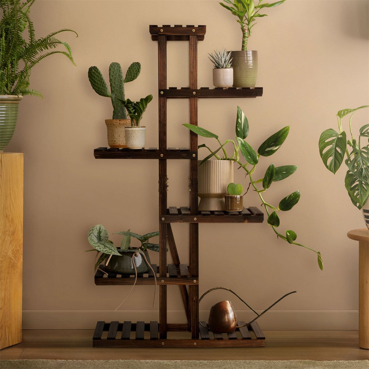 Wooden shelf with plants and various pots, decoratively placed in a room.