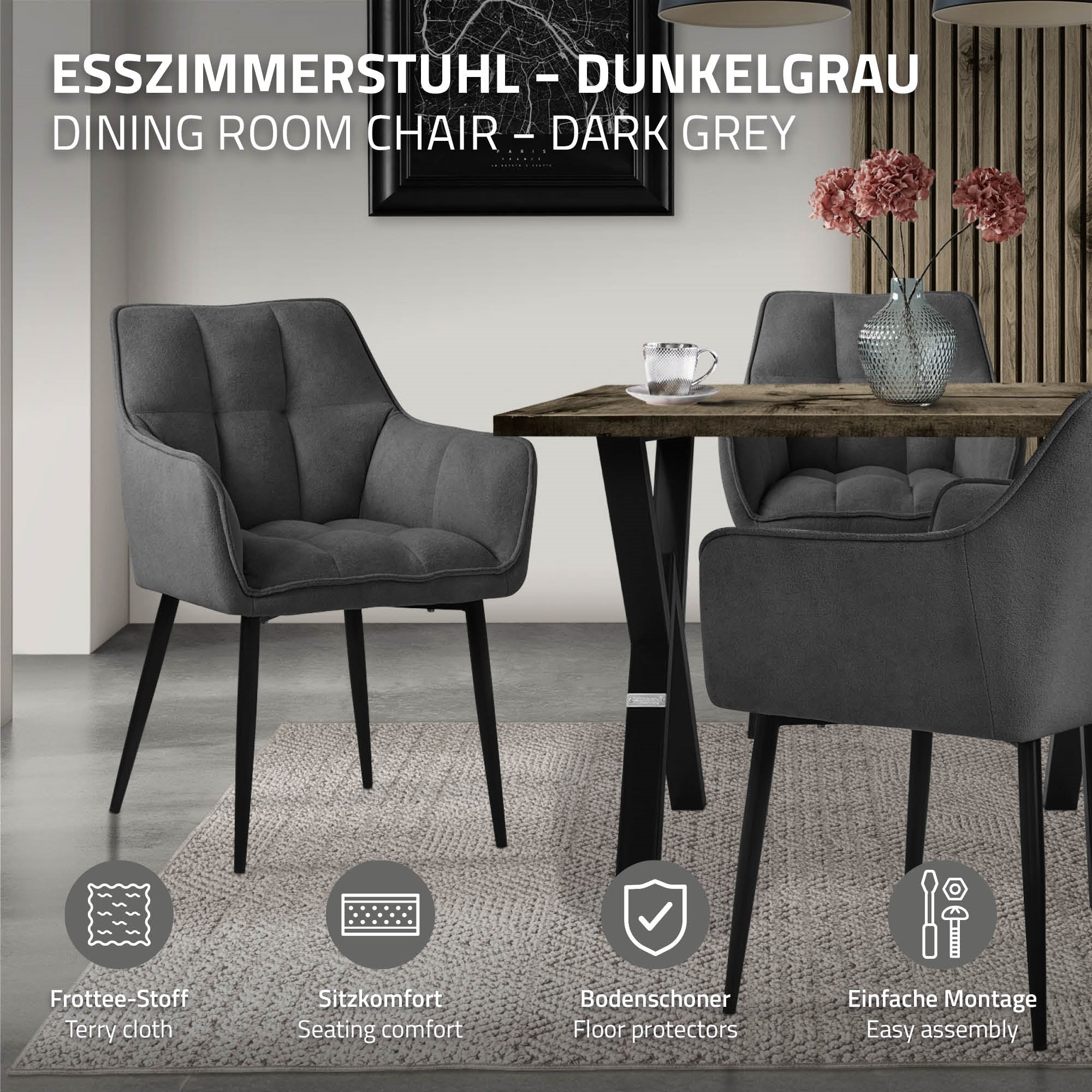 Sedia da pranzo grigio scuro accanto a un tavolo su un tappeto.