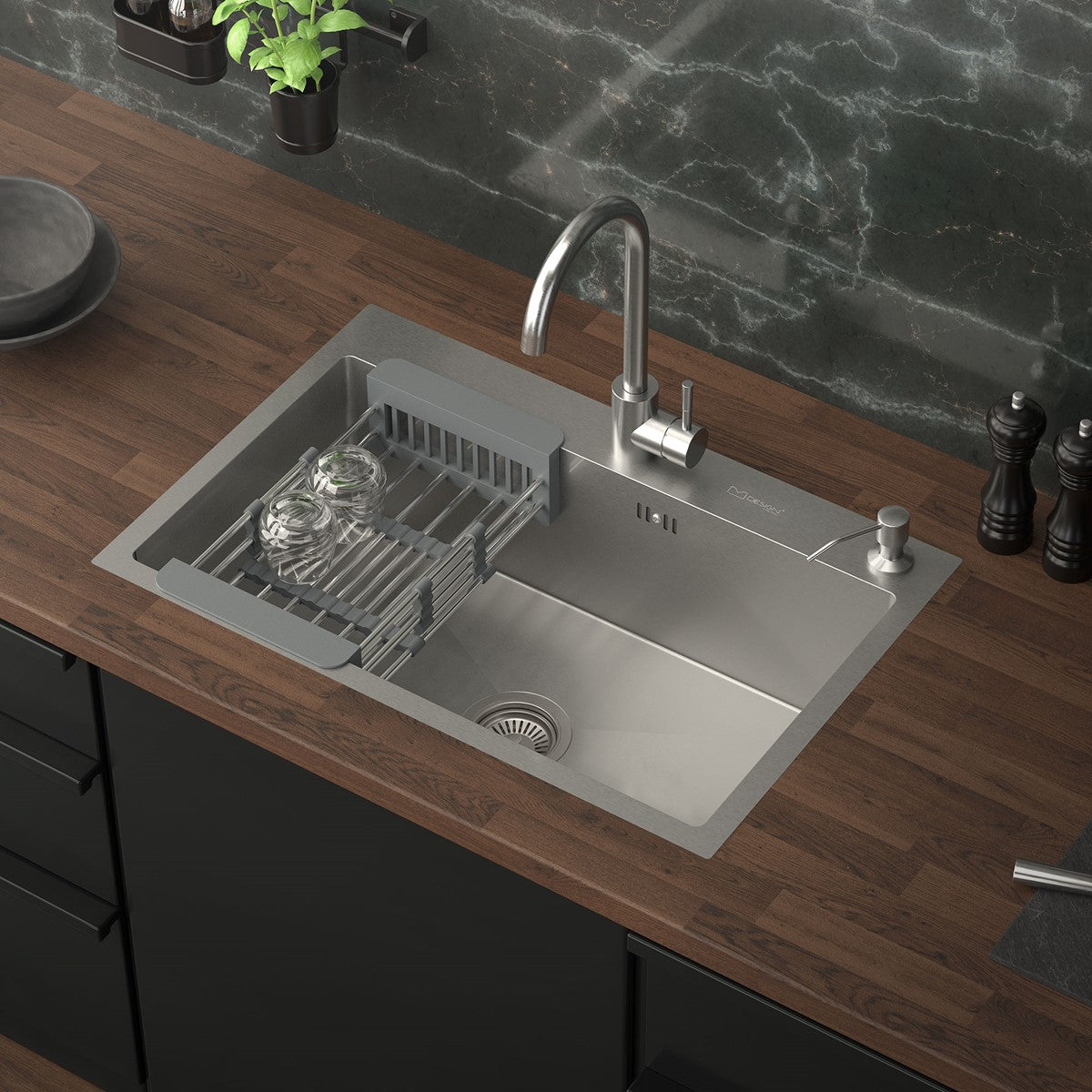 Kitchen unit with sink, draining board and wooden worktop.