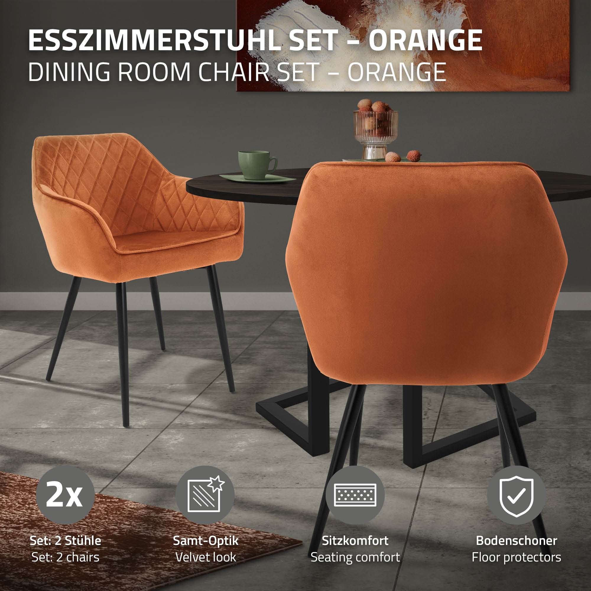 Deux chaises de salle à manger orange autour d'une table ronde.