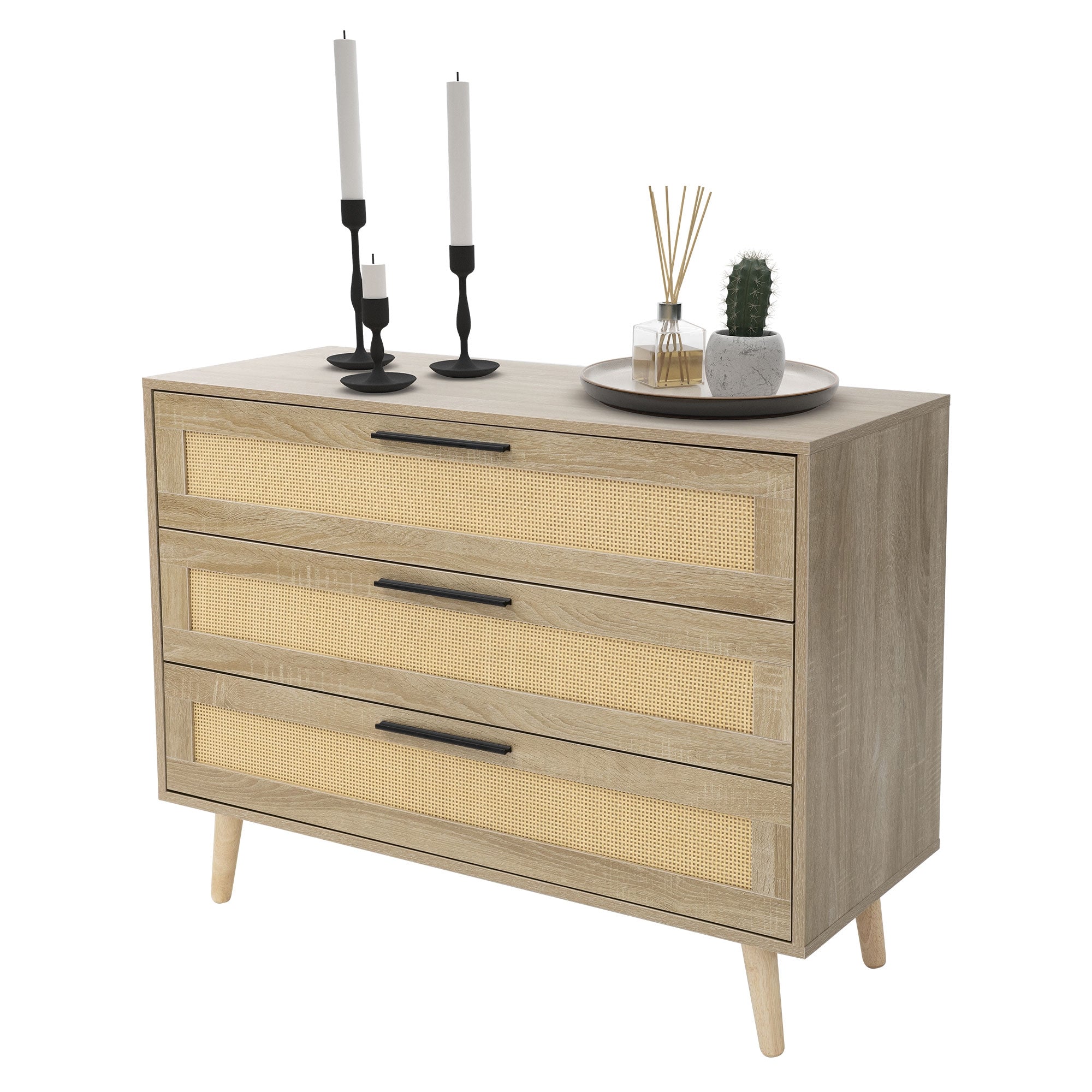 Commode en bois avec trois tiroirs, bougies et décoration sur la surface.