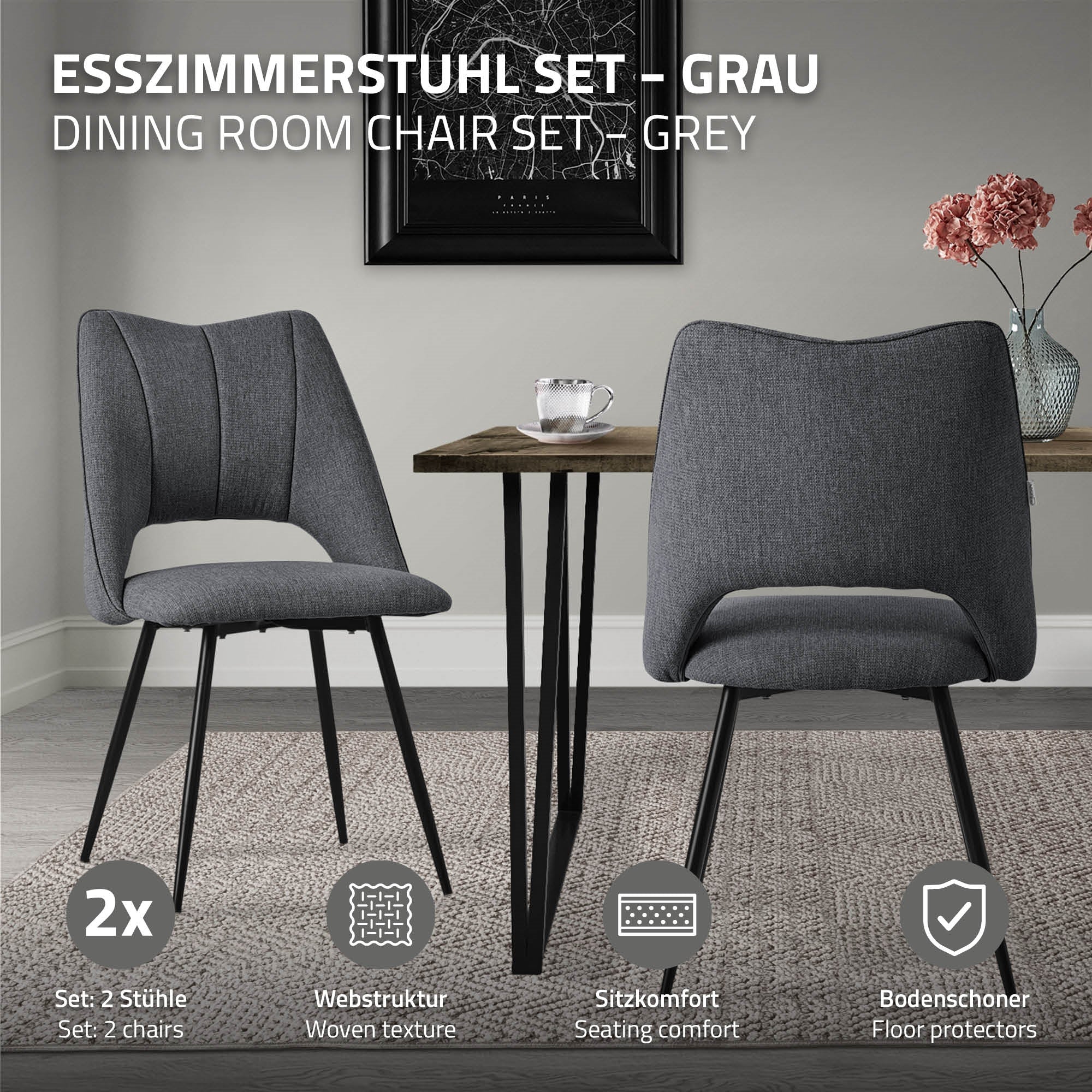 Zwei graue Esszimmerstühle vor einem Tisch auf einem Teppich.