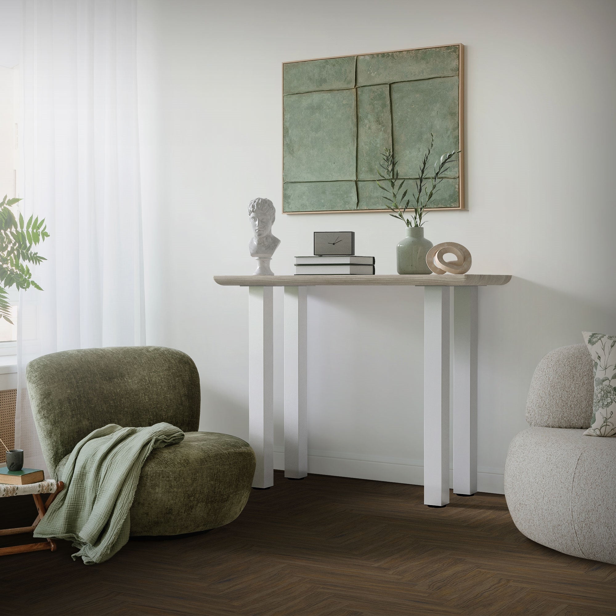 Living room with a table, a plant, and an armchair.