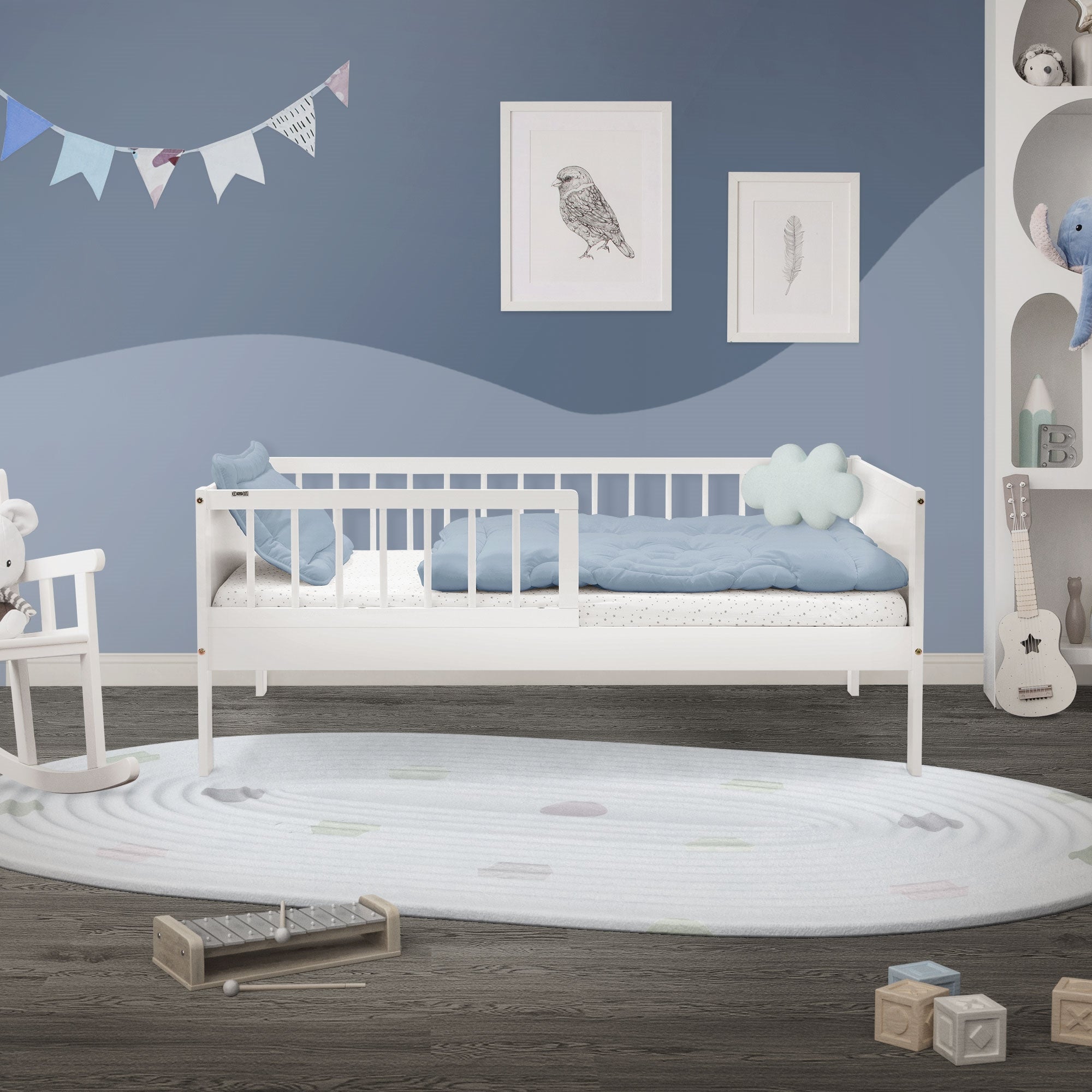 Children's room with bed, carpet, wall pictures, and toy shelf.