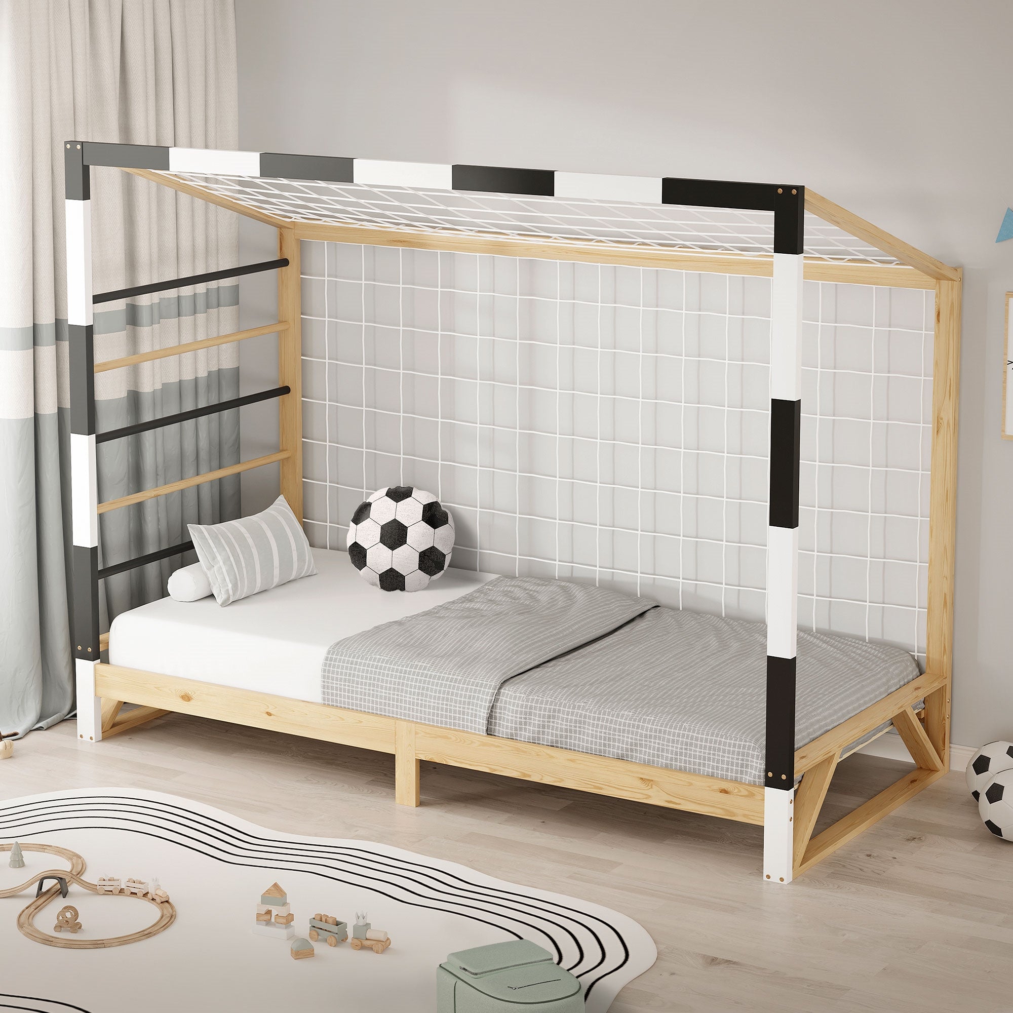 Un lit avec un treillis, un ballon de football et un coussin gris.