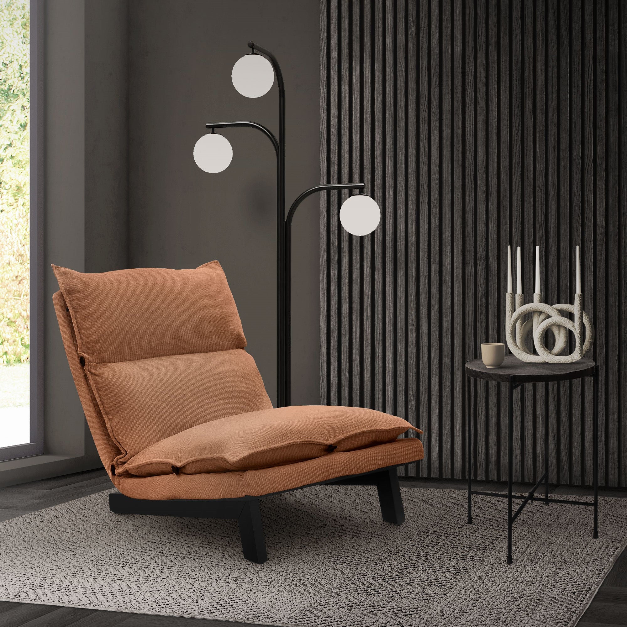 Beige armchair next to a floor lamp and a table in a modern room.