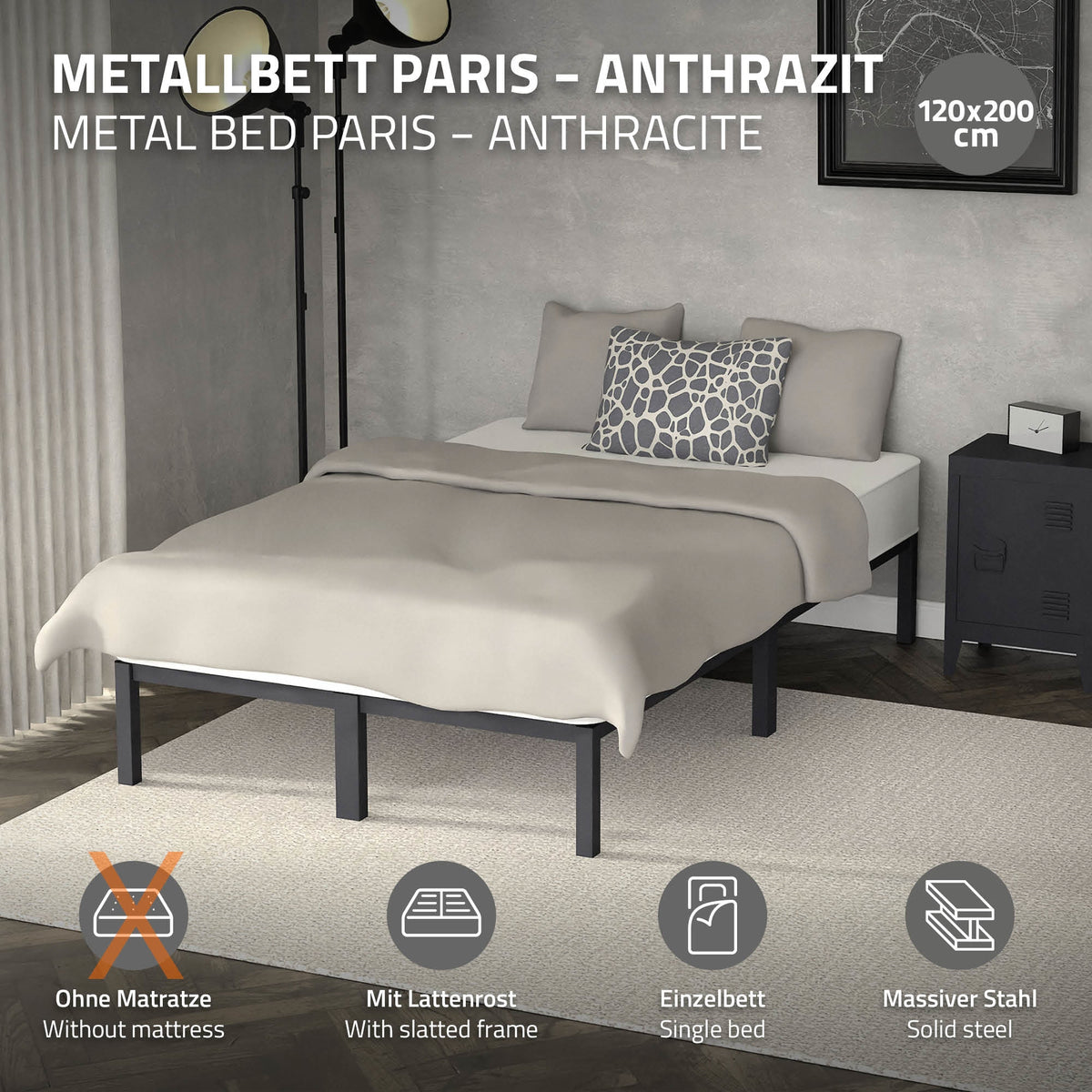 Letto in metallo antracite con cuscini e coperta, senza materasso.