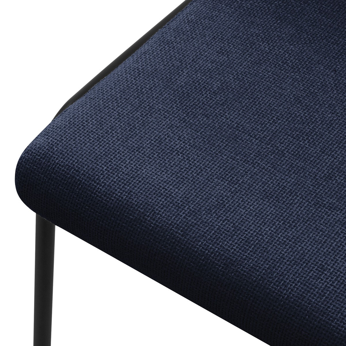Close-up of the seat of a blue chair with a textile upholstery.